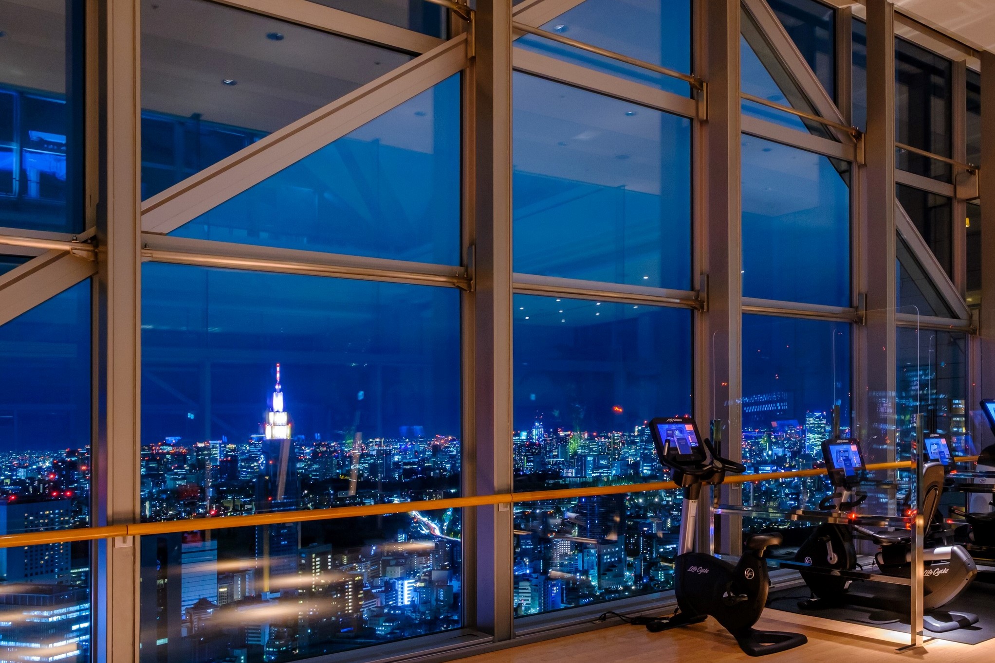 The fitness center at the Park Hyatt Tokyo features incredible views The fitness center at the Park Hyatt Tokyo features incredible views