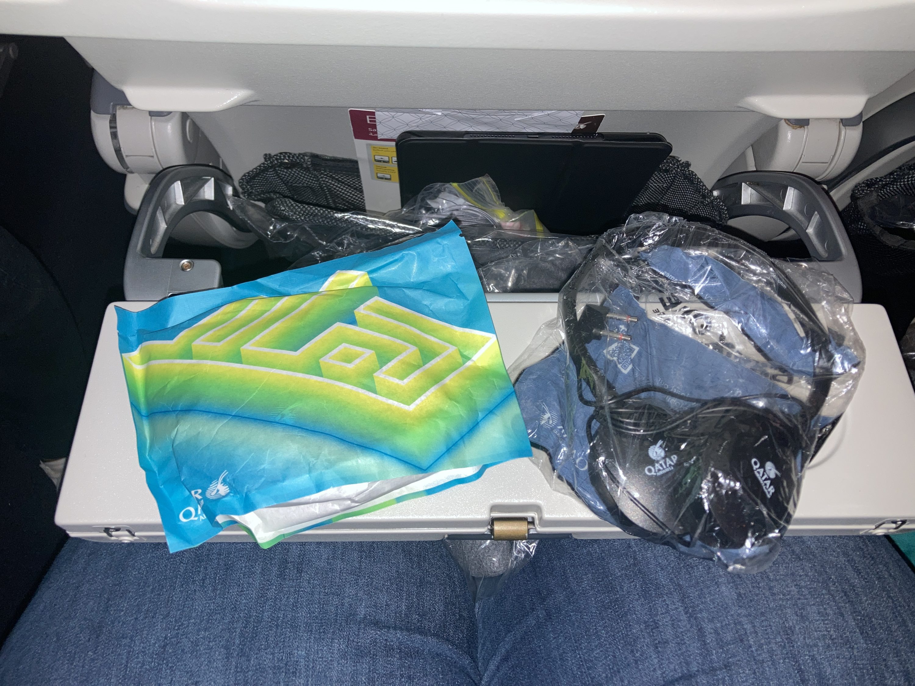 Qatar Airways 777 DOH DFW economy amenity kit headphones