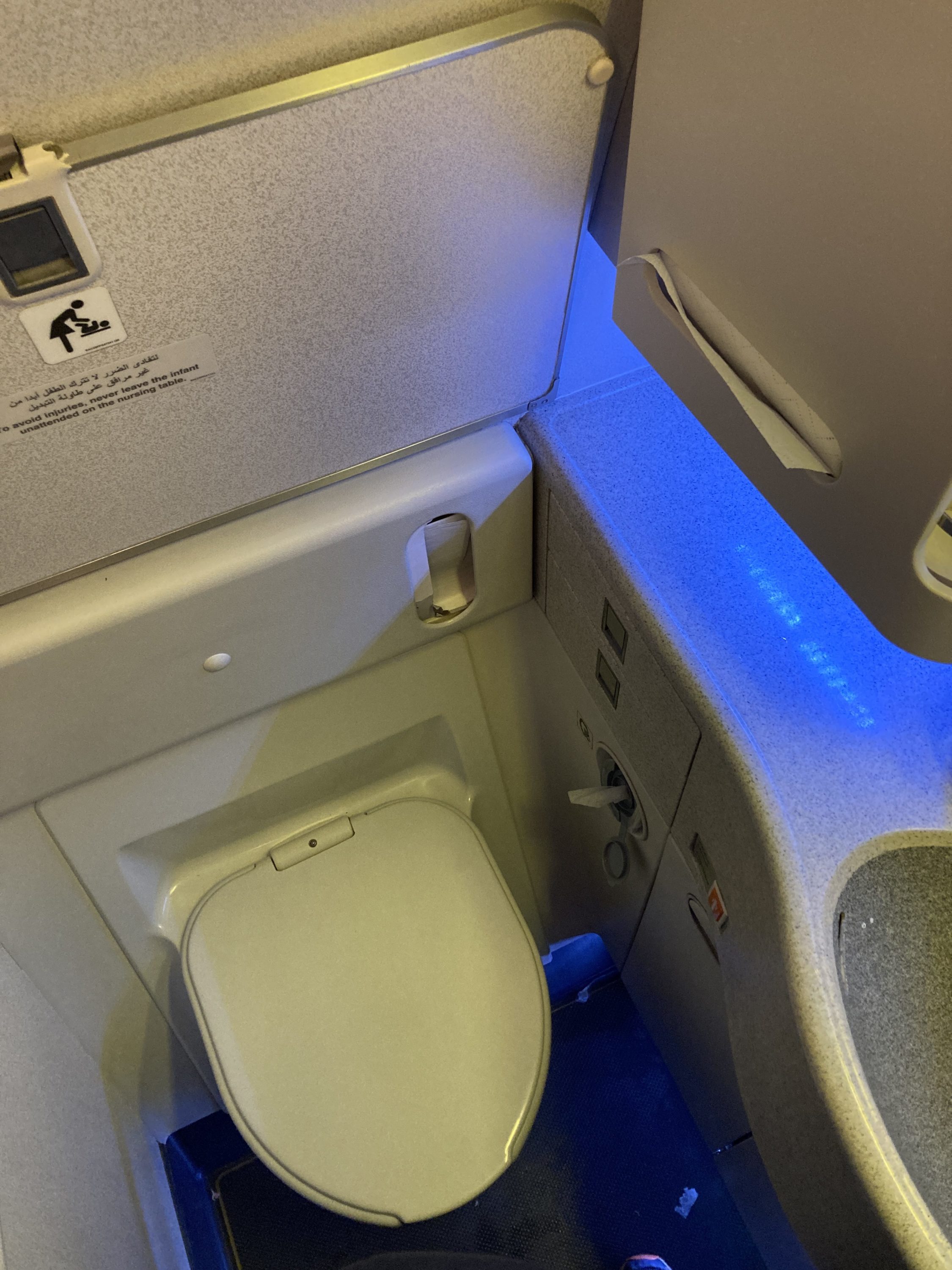Qatar Airways 777 DOH DFW economy bathroom