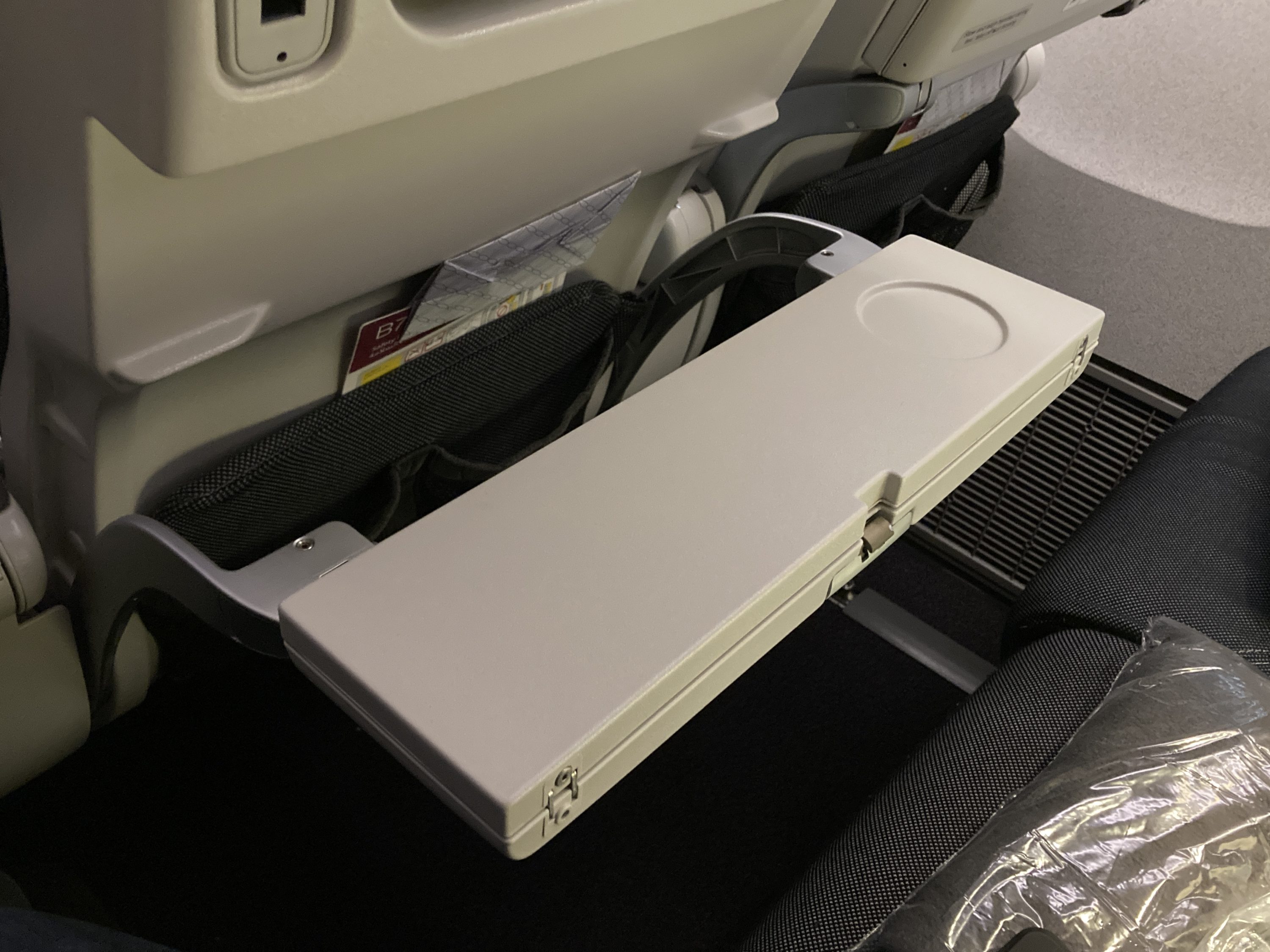 Qatar Airways 777 DOH DFW economy half tray table