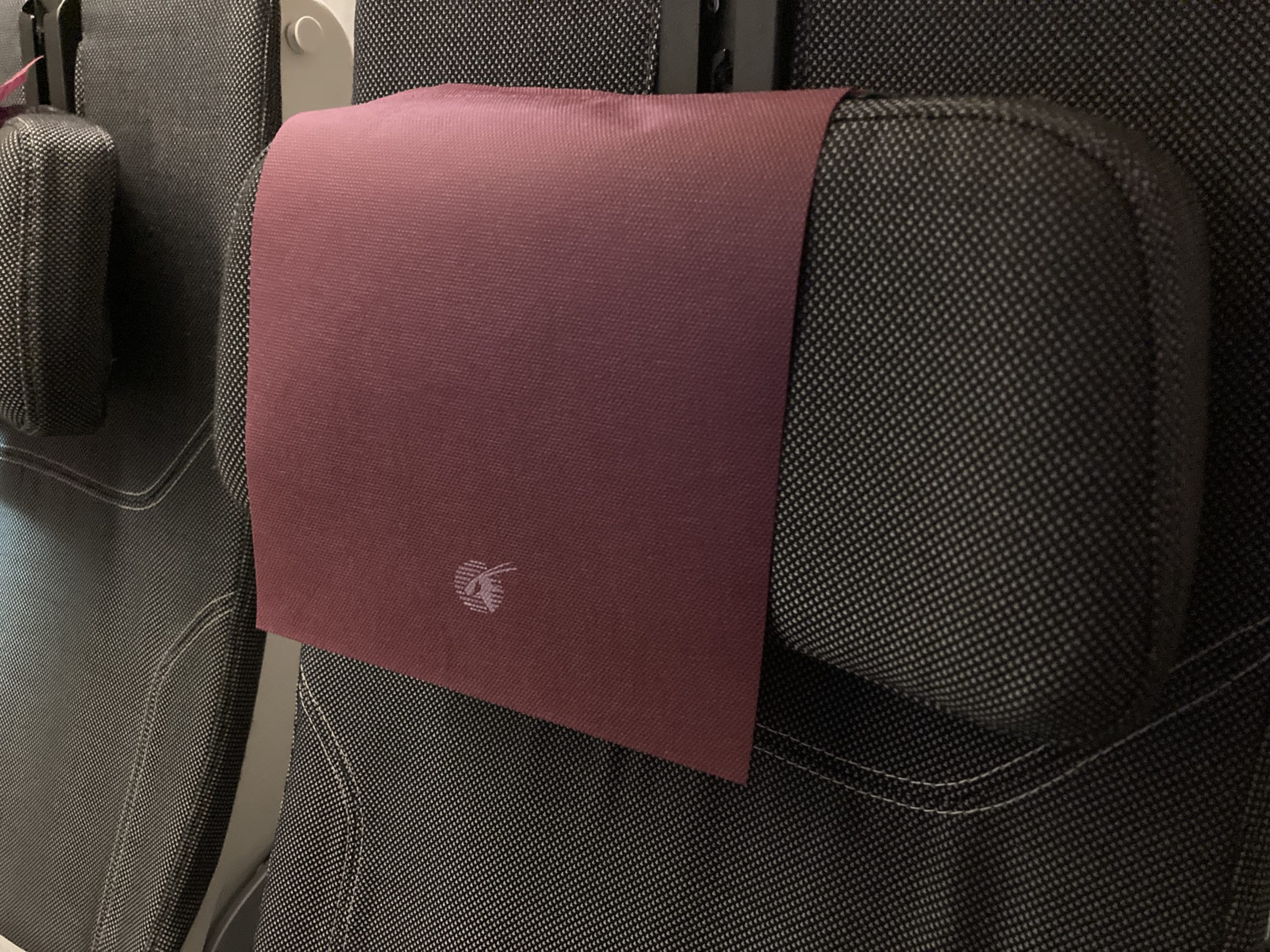 Qatar Airways 777 DOH DFW economy headrest