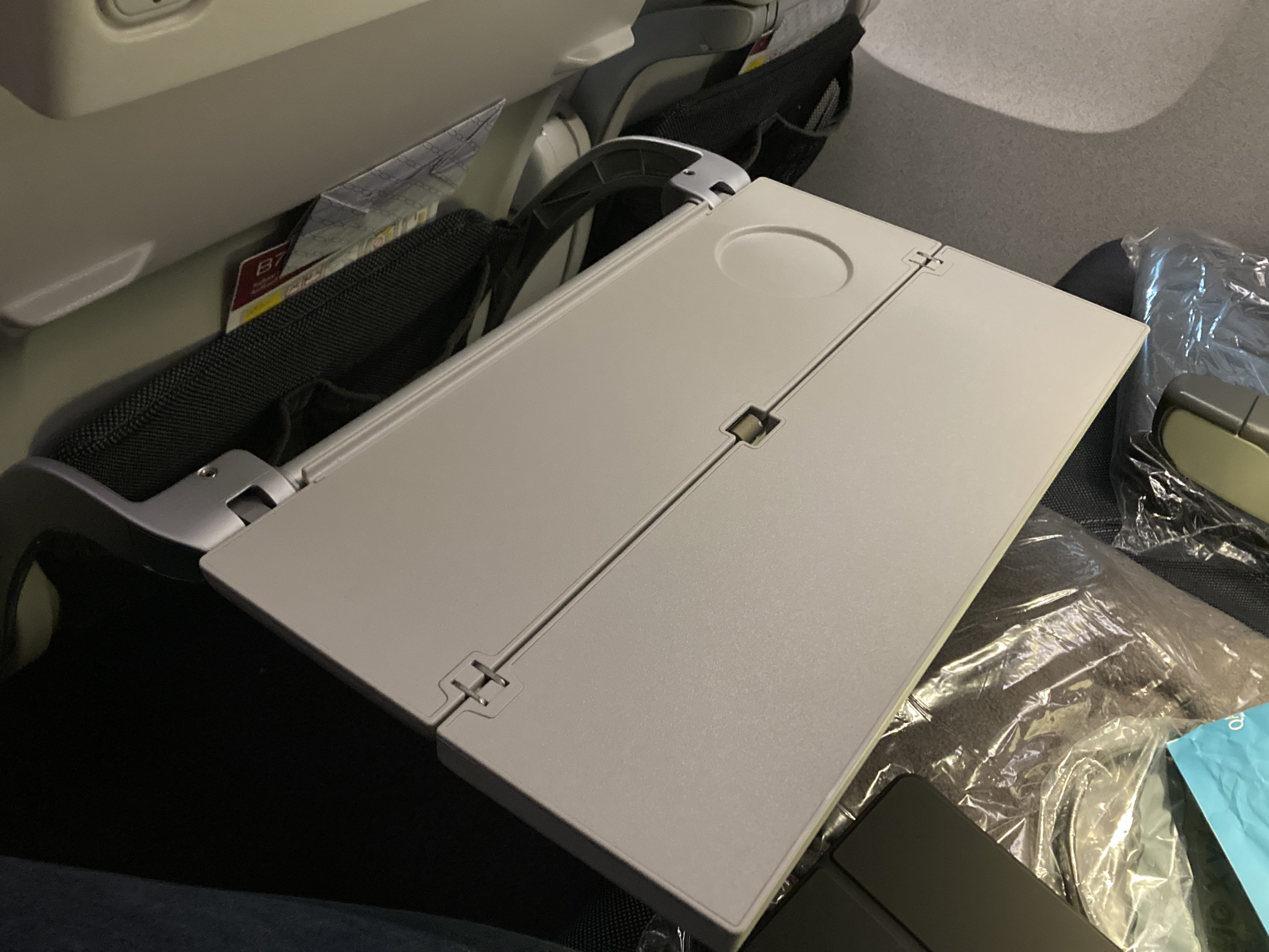Qatar Airways 777 DOH DFW economy opened tray table