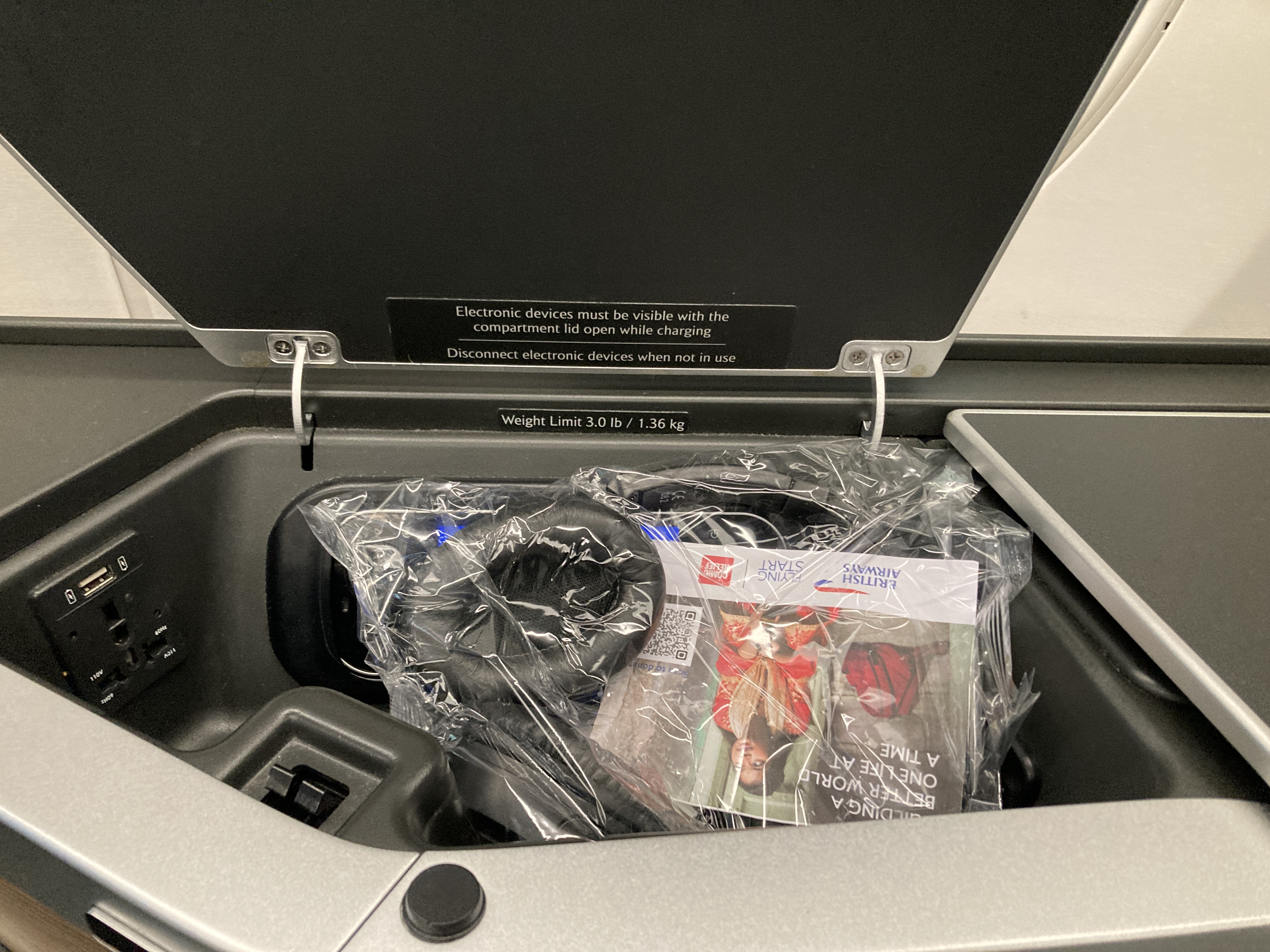British Airways A350 1000 Club Suites review LAS LHR arm rest bin with headphones 