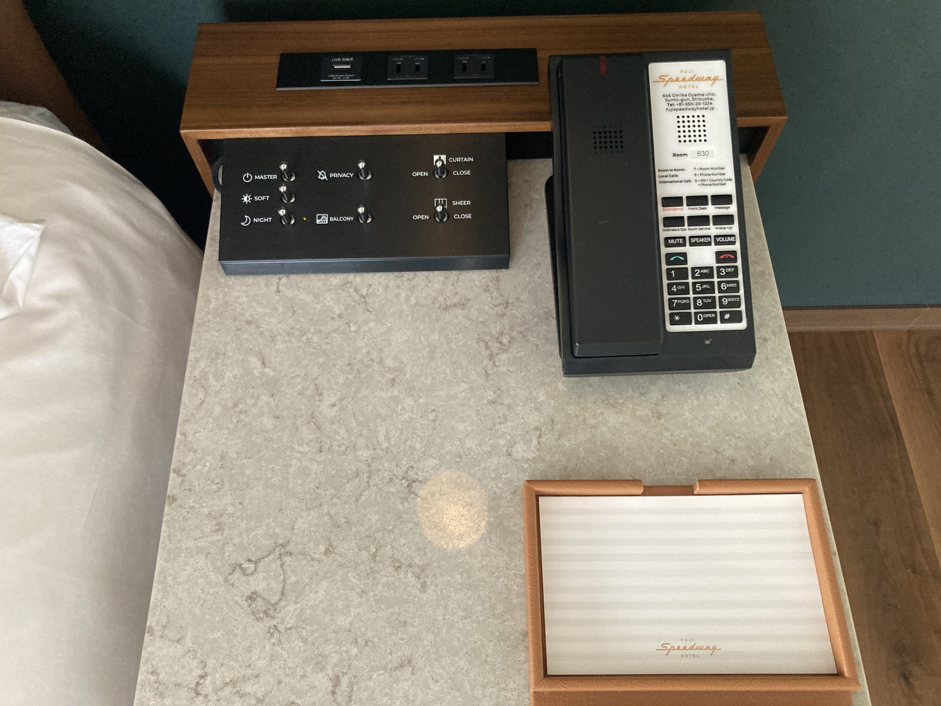 Fuji Speedway Hotel Grand Prix Corner King Suite bedroom night stand notepad controls phone