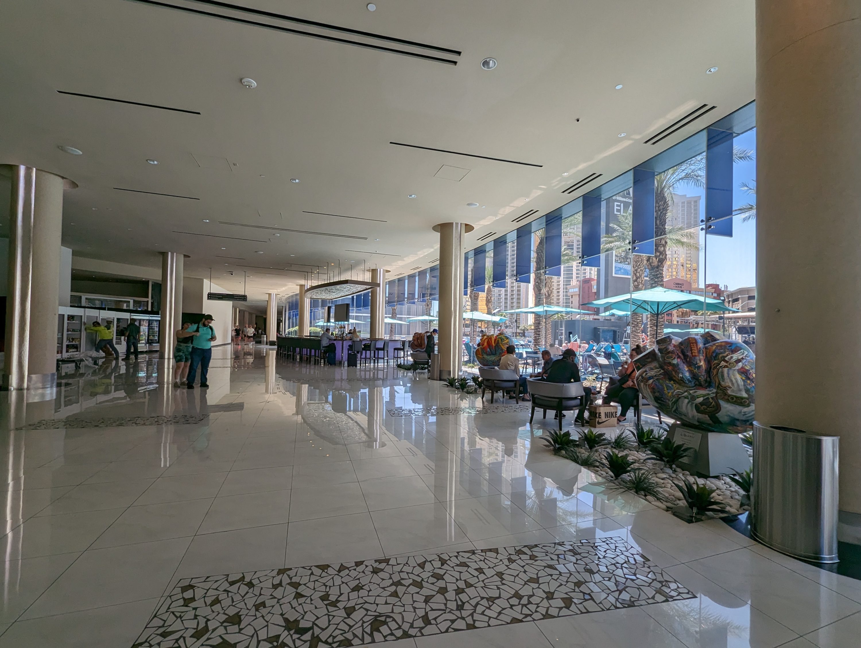 Hilton Grand Vacations Elara Las Vegas lobby seating and art