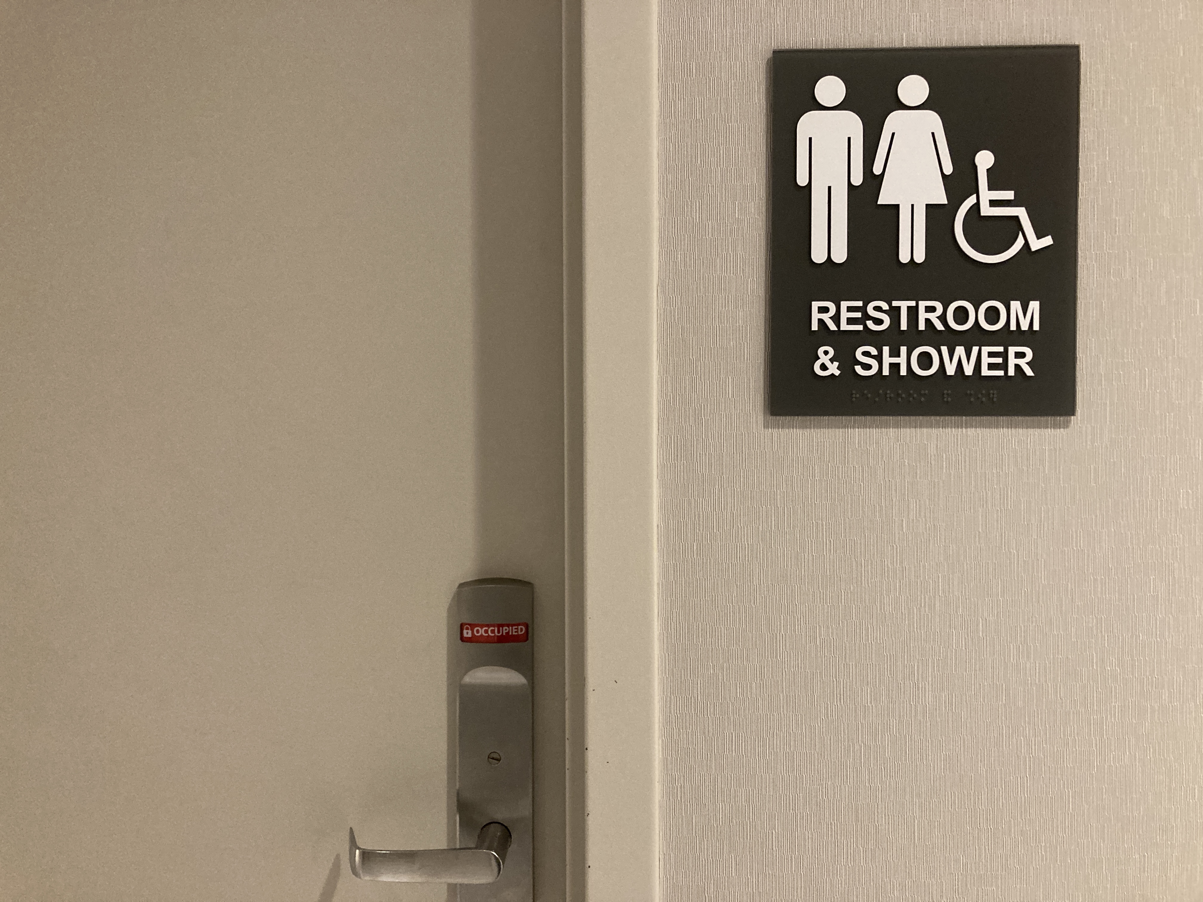The Club LAS lounge restroom shower sign