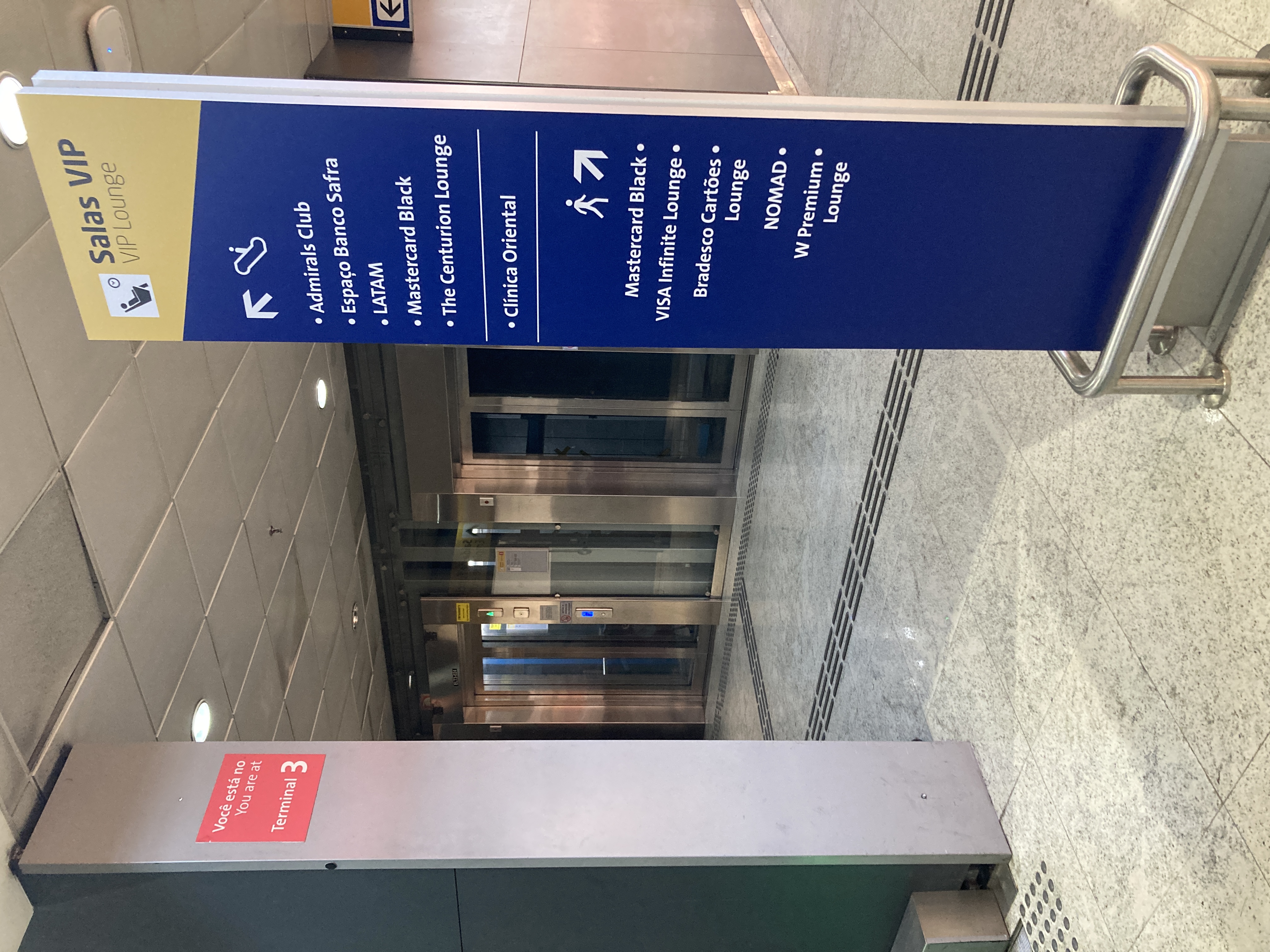 American Express Centurion Lounge Sao Paulo GRU sign near escalators