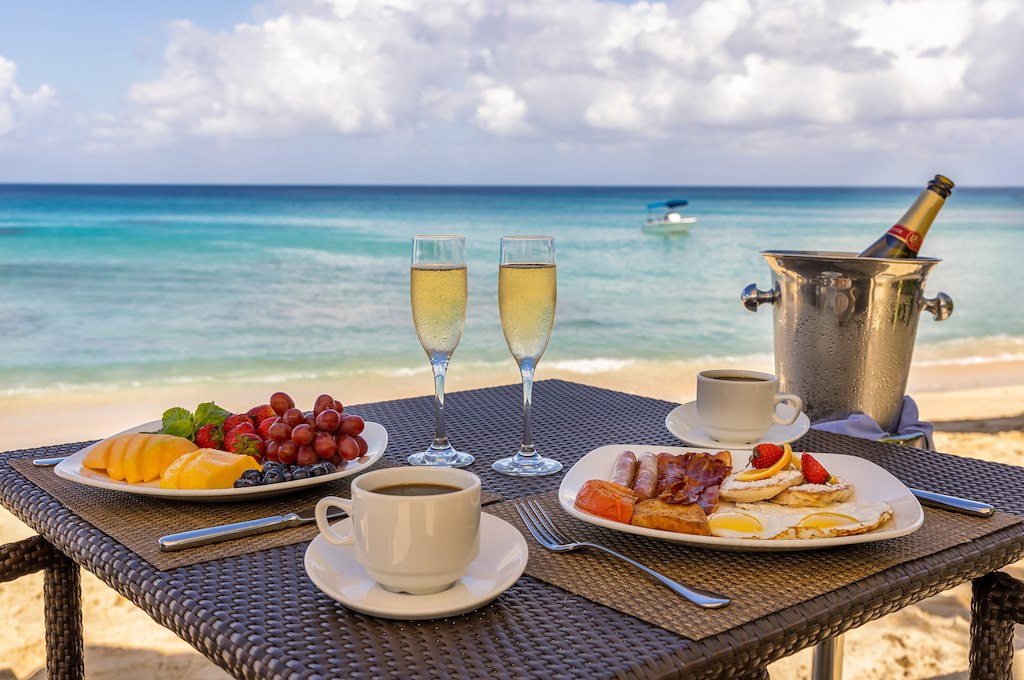 Beachfront dining at The House by Elegant Hotels Beachfront dining at The House by Elegant Hotels