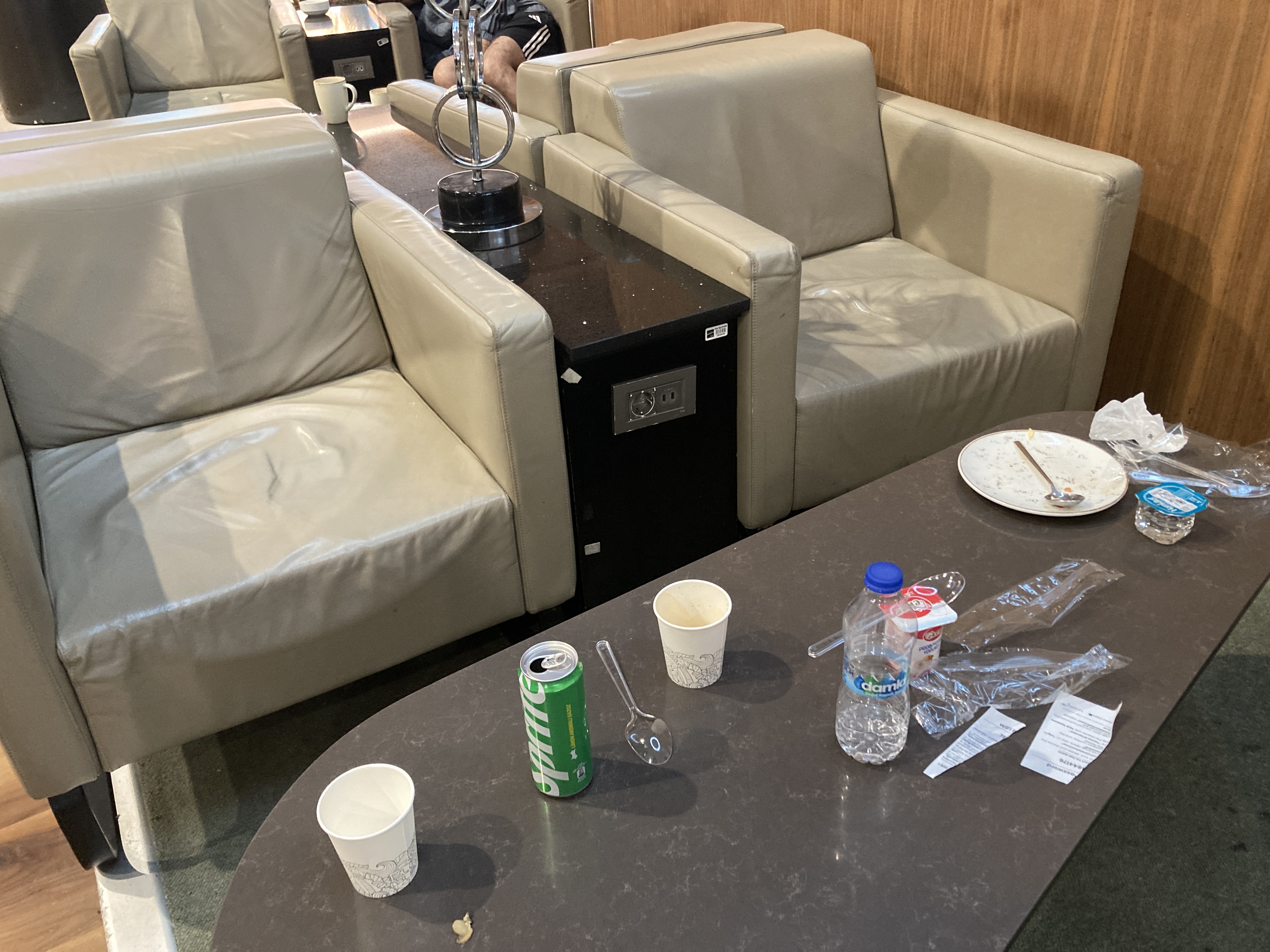 IGA Lounge IST trash on table IGA Lounge IST trash on table