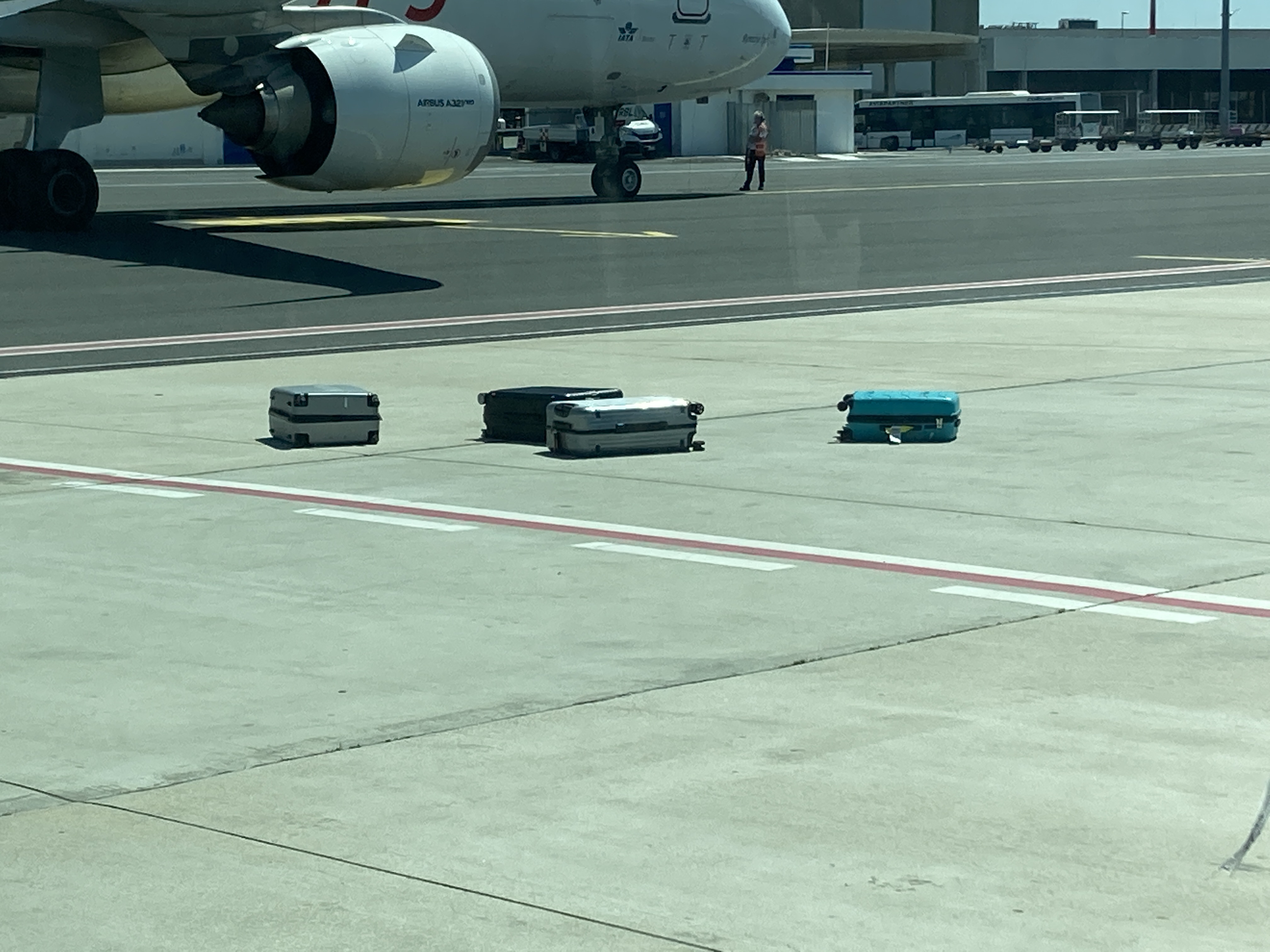 ITA baggage on tarmac seen from shuttle ITA baggage on tarmac seen from shuttle