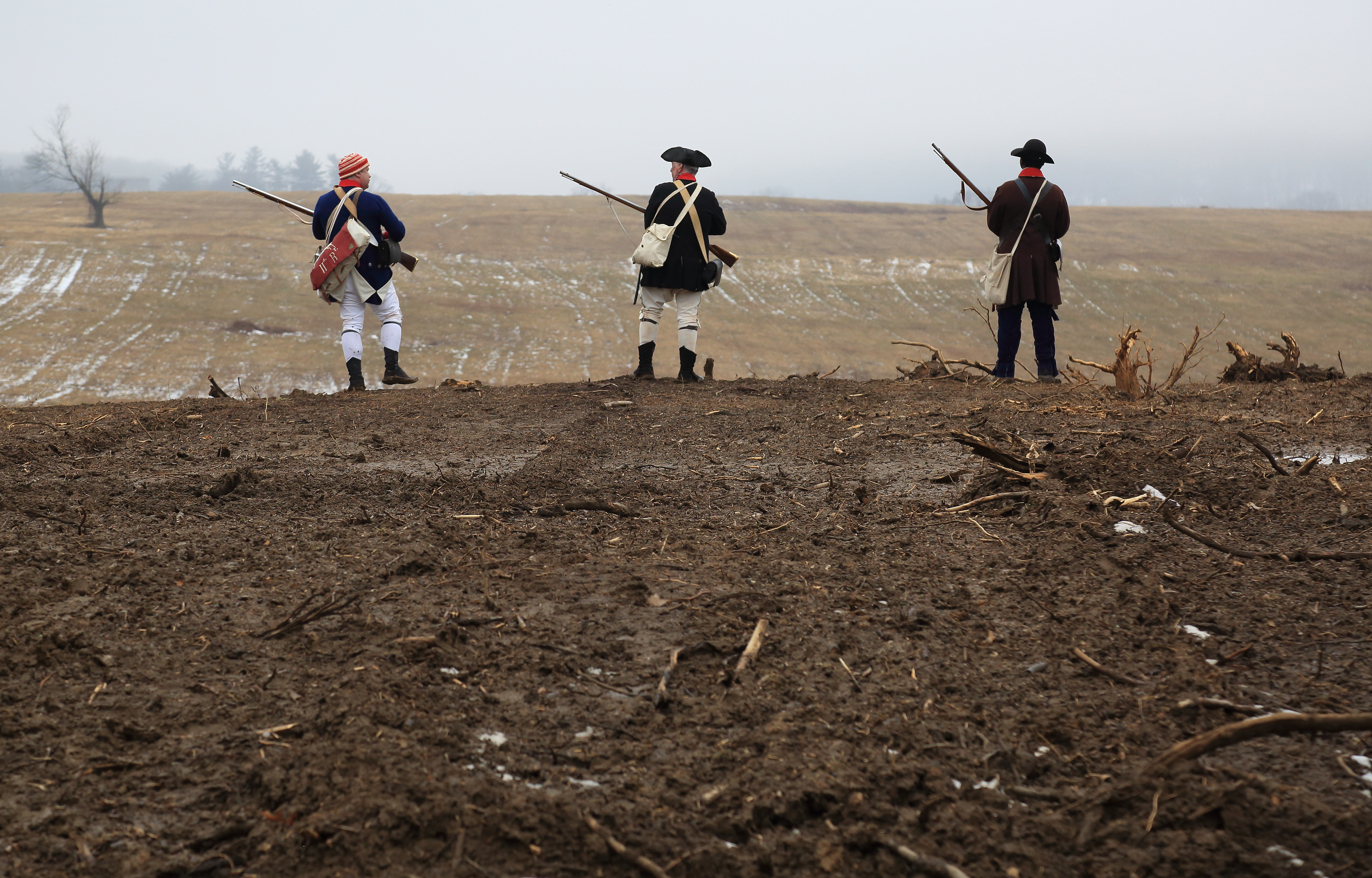 Reenactors Overlooking Mowed Meadows