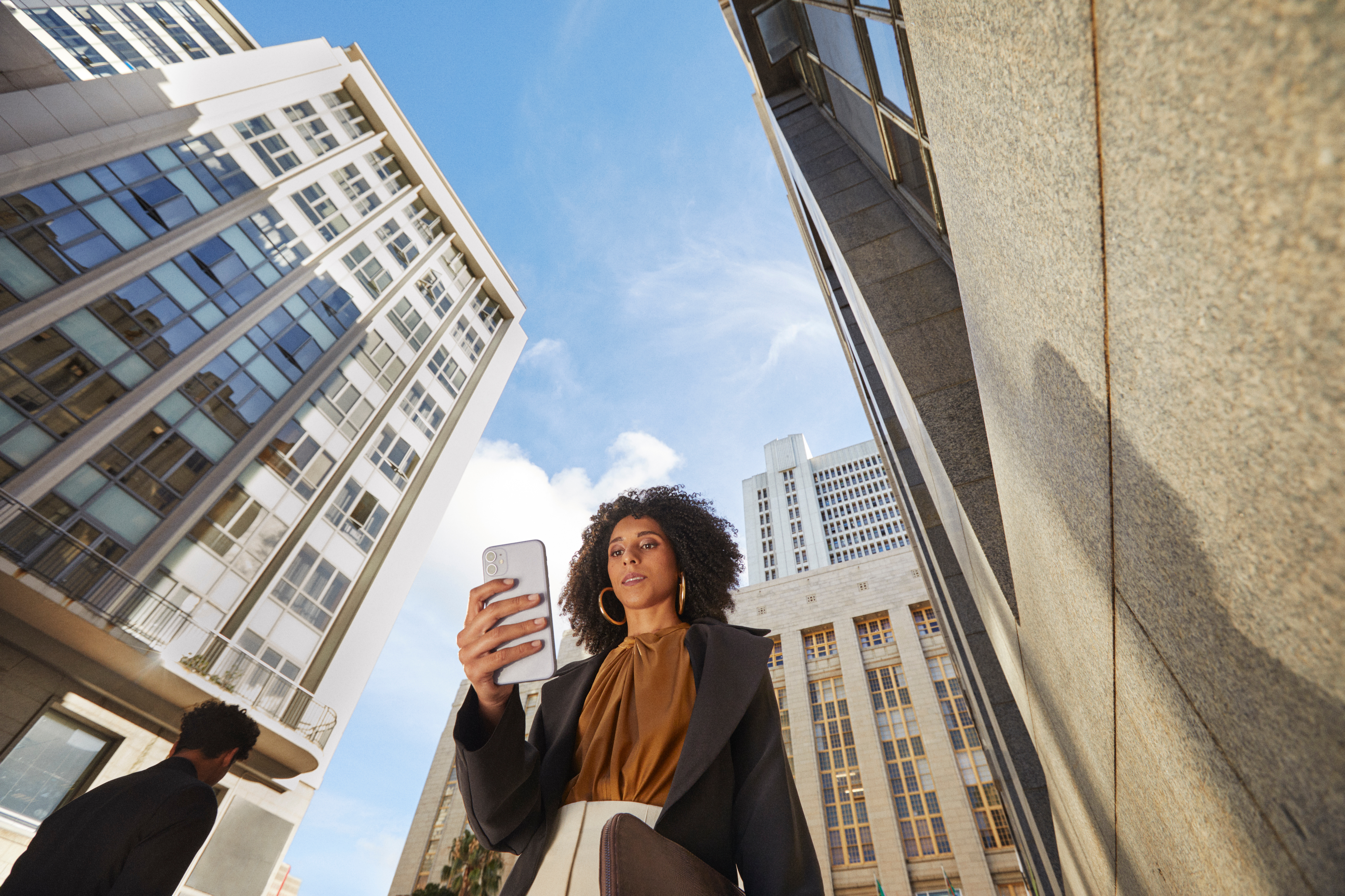 Woman on phone in city