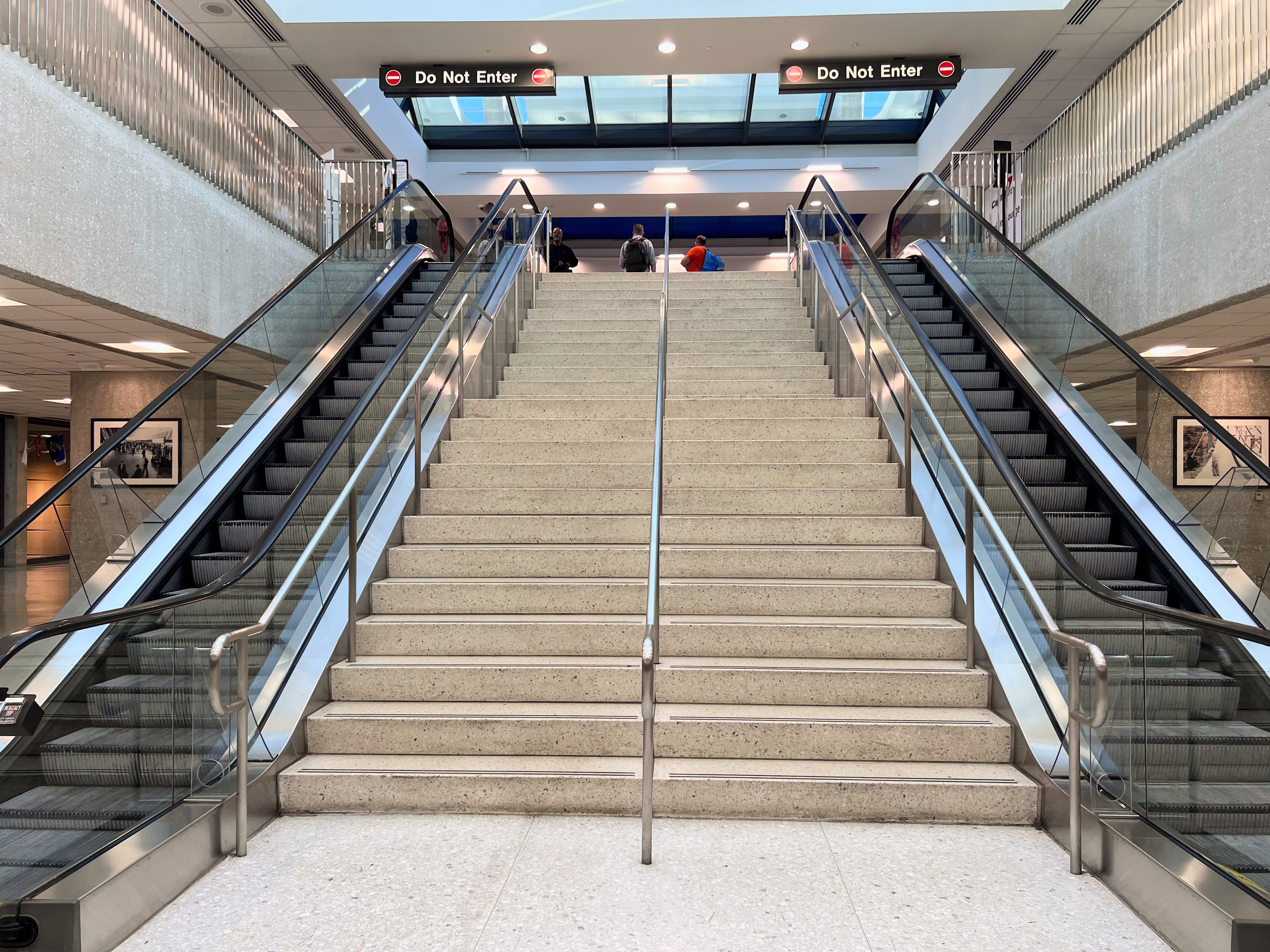 escalators and stairs by the IAD Capital One Lounge