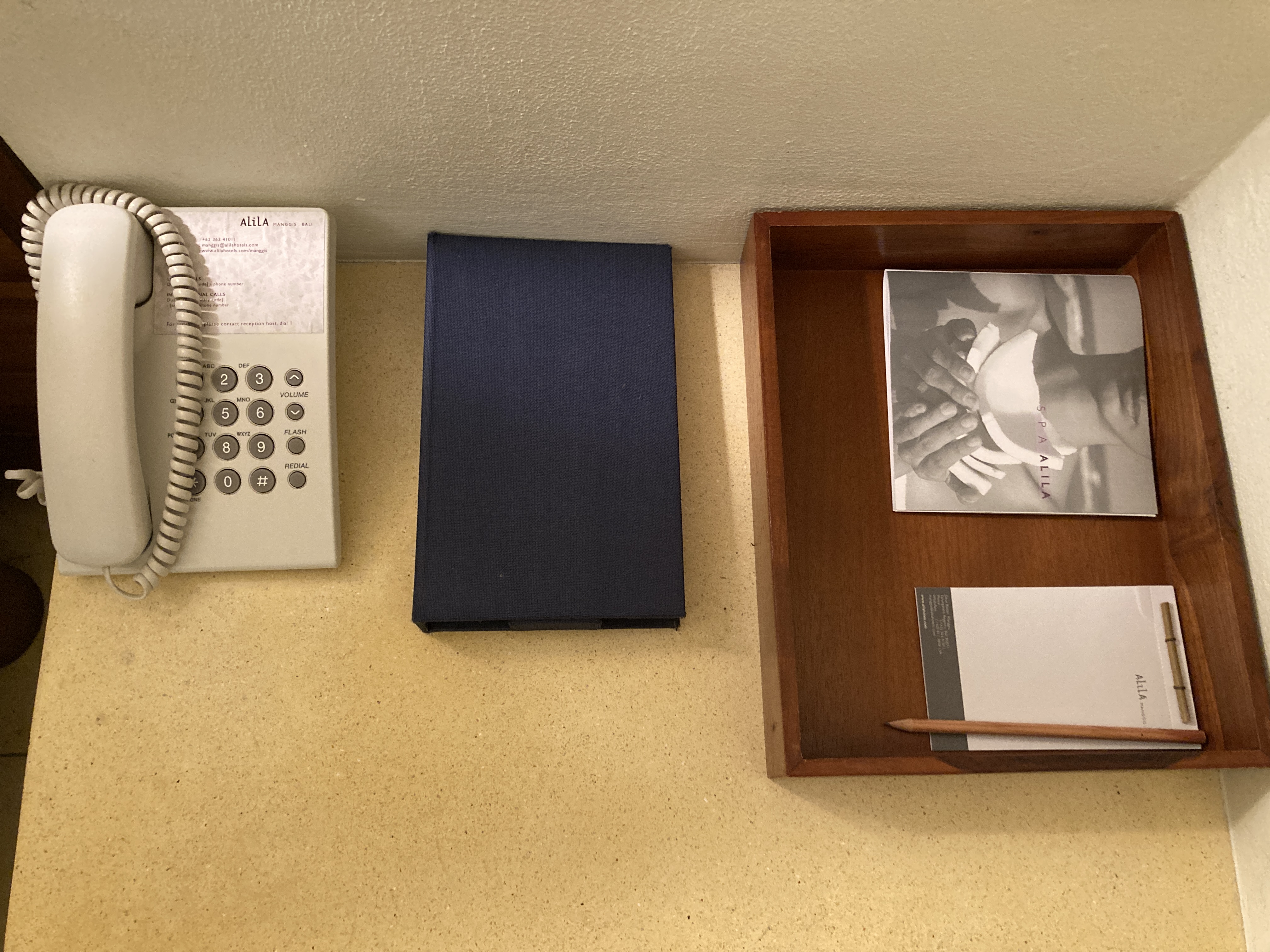 Alila Manggis Bali bedroom night stand with phone Alila Manggis Bali bedroom night stand with phone