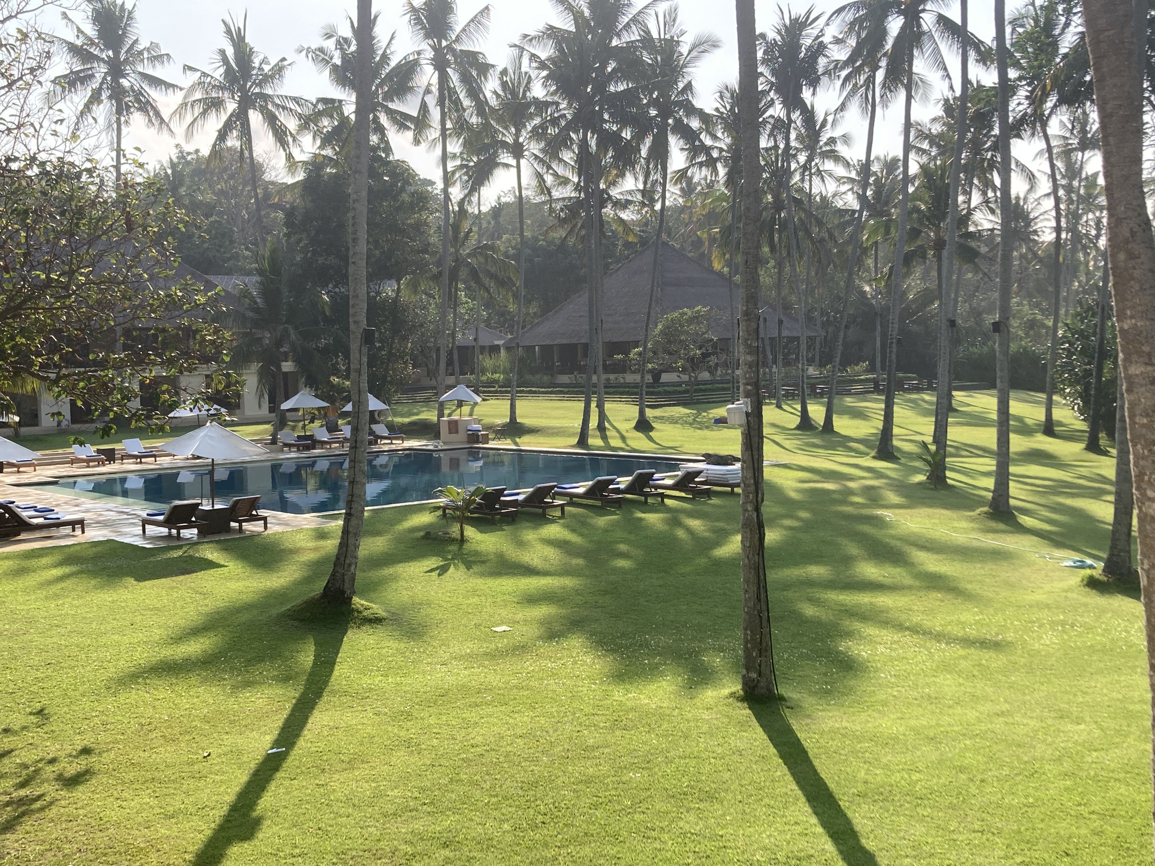 Alila Manggis Bali bedroom view from balcony to pool Alila Manggis Bali bedroom view from balcony to pool