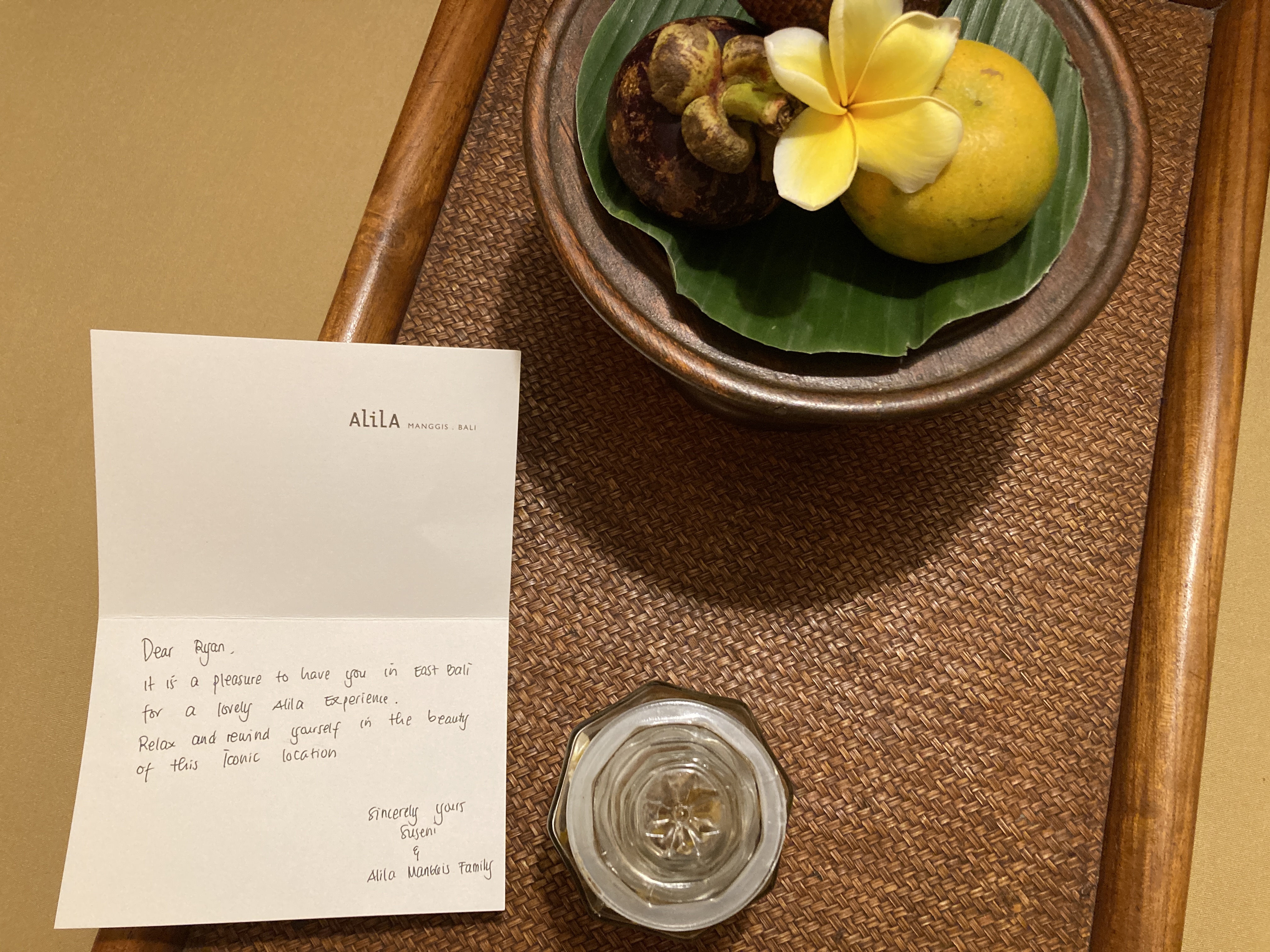 Alila Manggis Bali bedroom welcome snacks and note Alila Manggis Bali bedroom welcome snacks and note