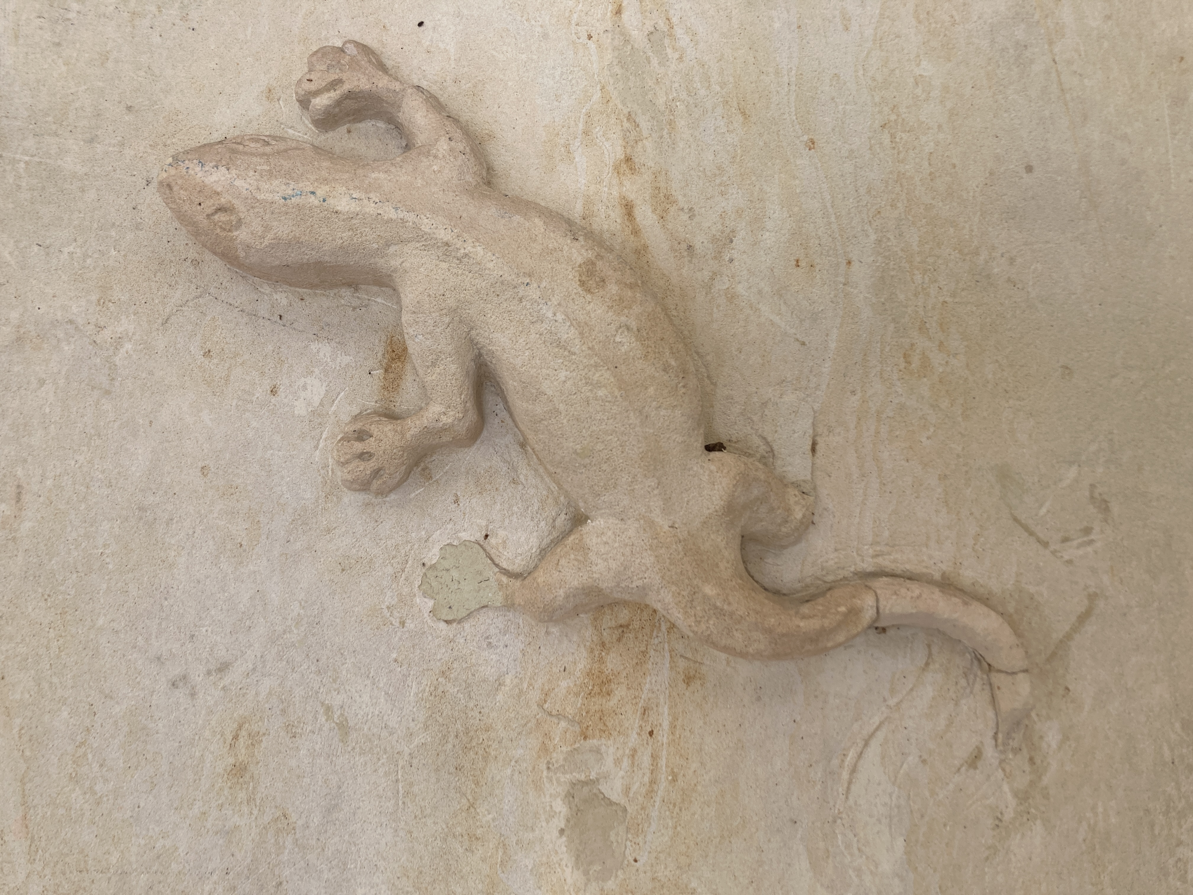 Alila Manggis Bali lizard carving on wall Alila Manggis Bali lizard carving on wall