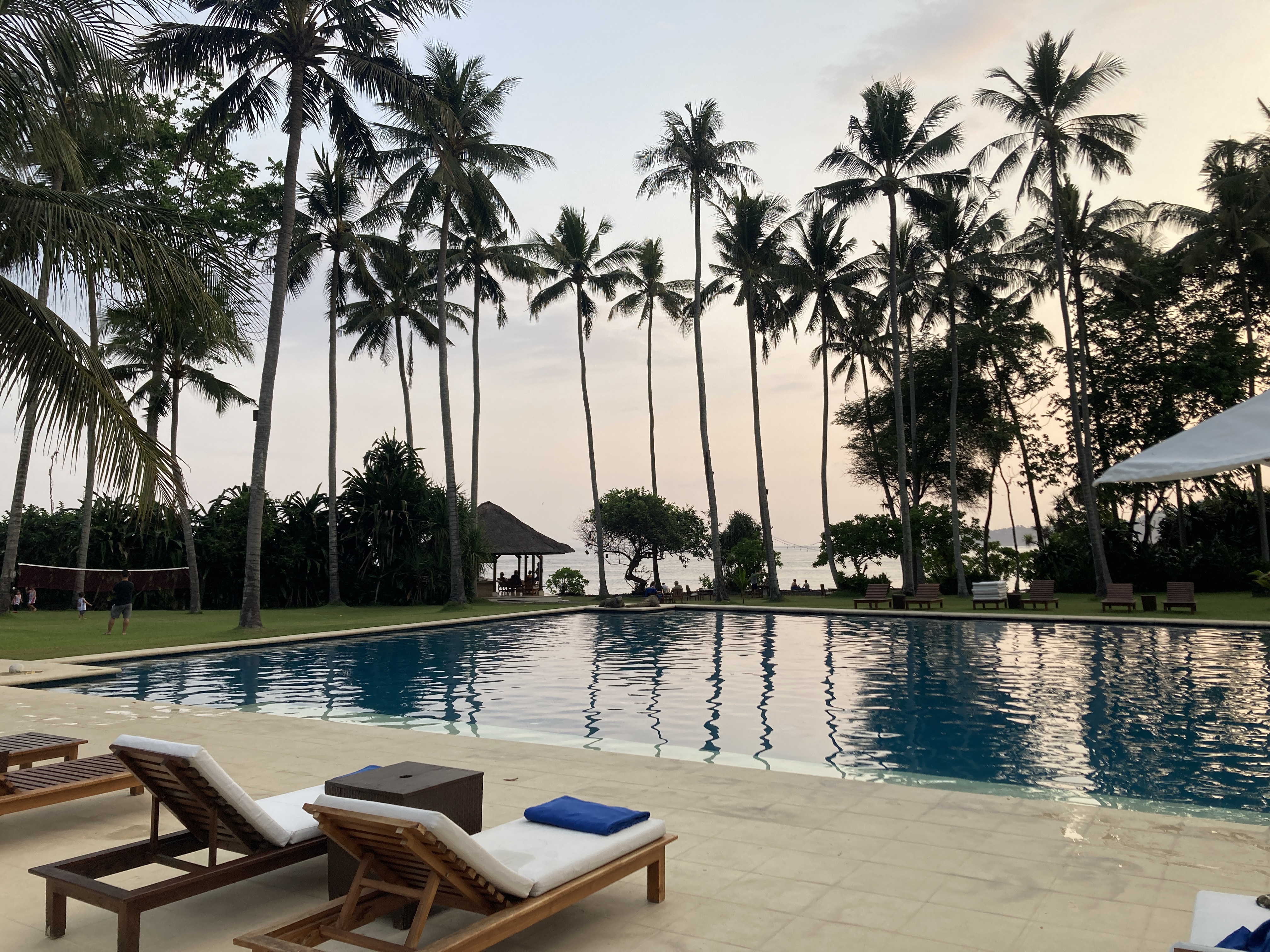 Alila Manggis Bali pool at sunset Alila Manggis Bali pool at sunset
