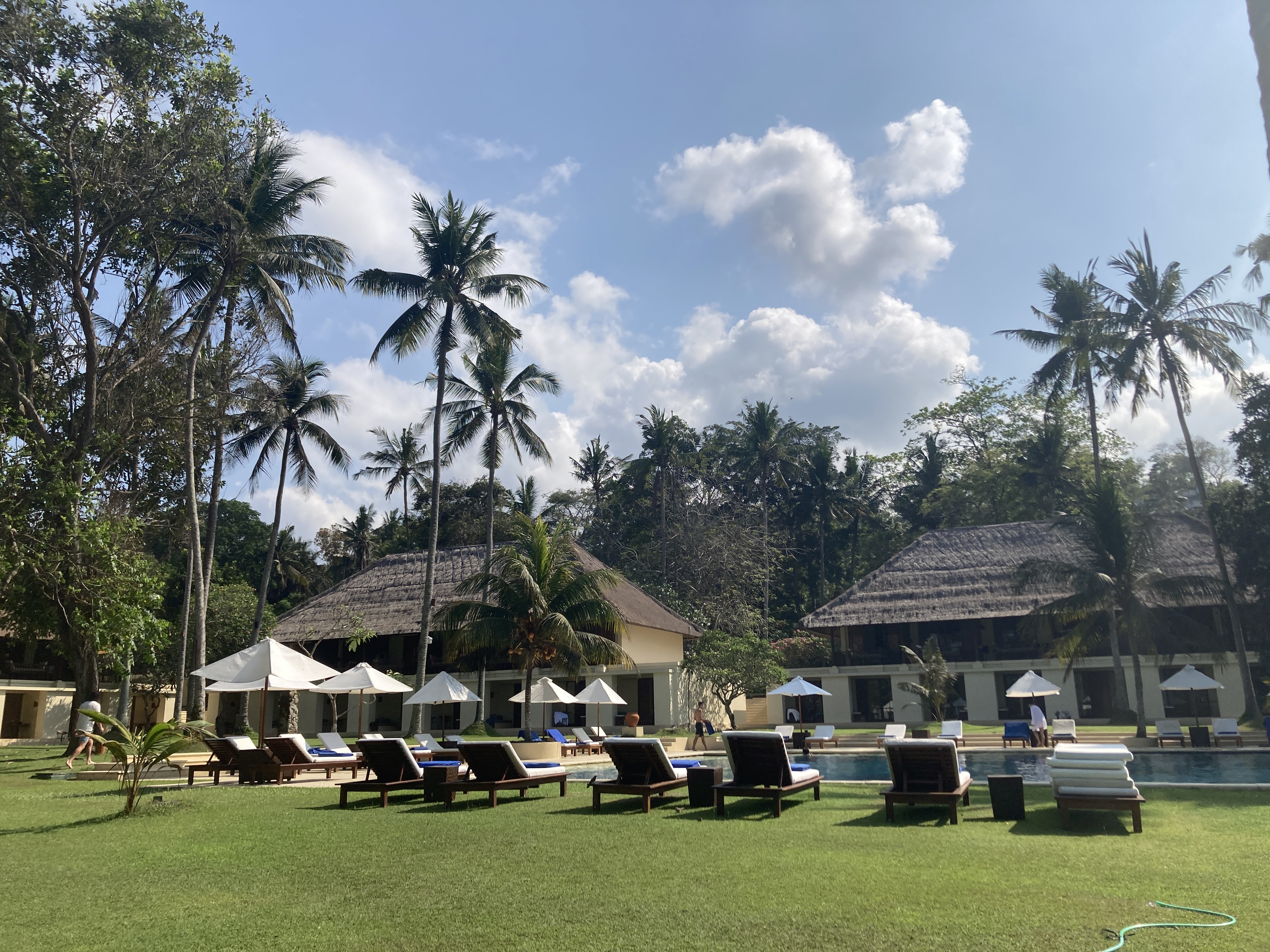 Alila Manggis Bali pool with lounge chairs Alila Manggis Bali pool with lounge chairs