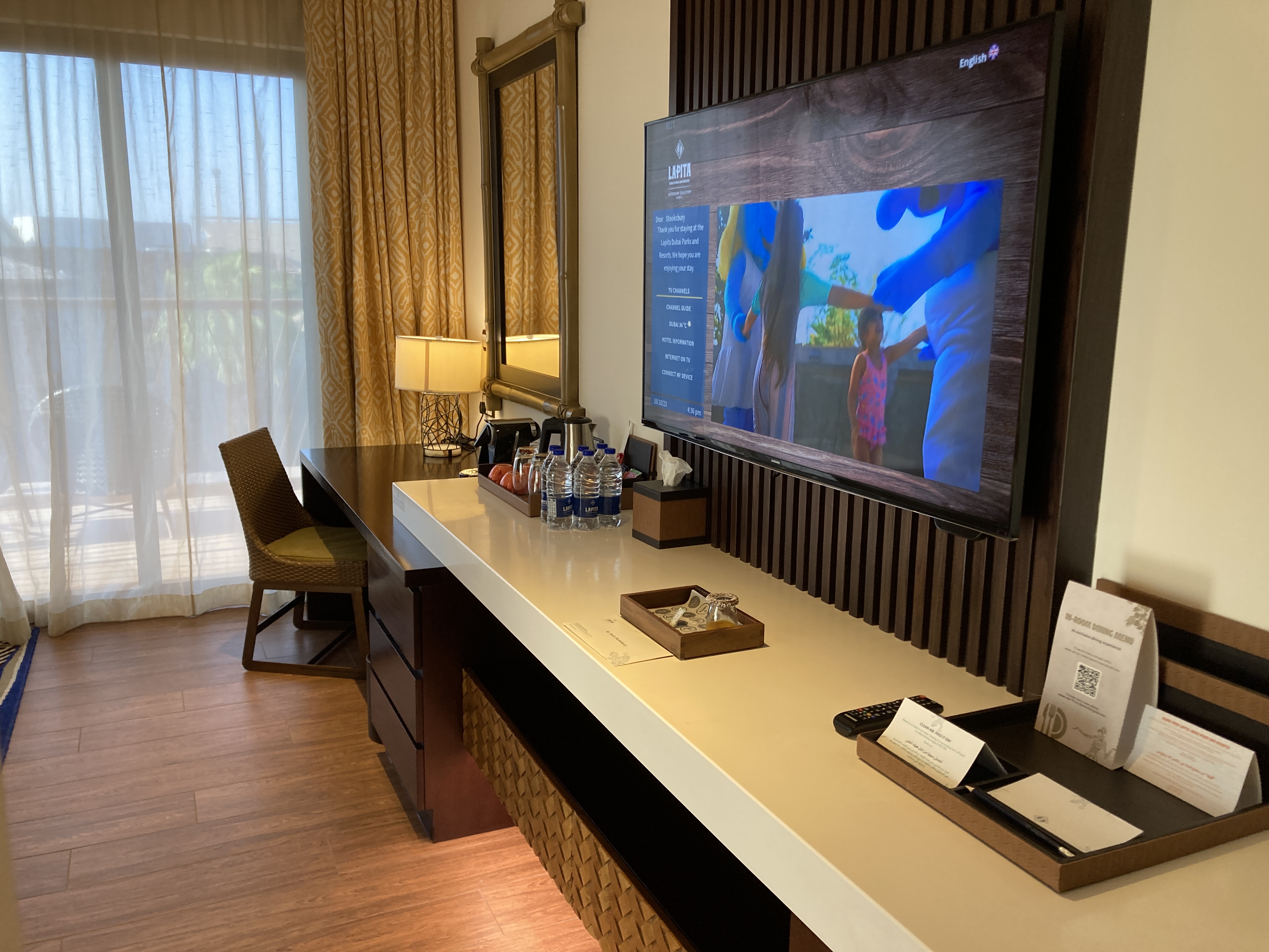 Lapita Dubai Parks and Resorts Autograph Collection junior suite living room desk tv Lapita Dubai Parks and Resorts Autograph Collection junior suite living room desk tv