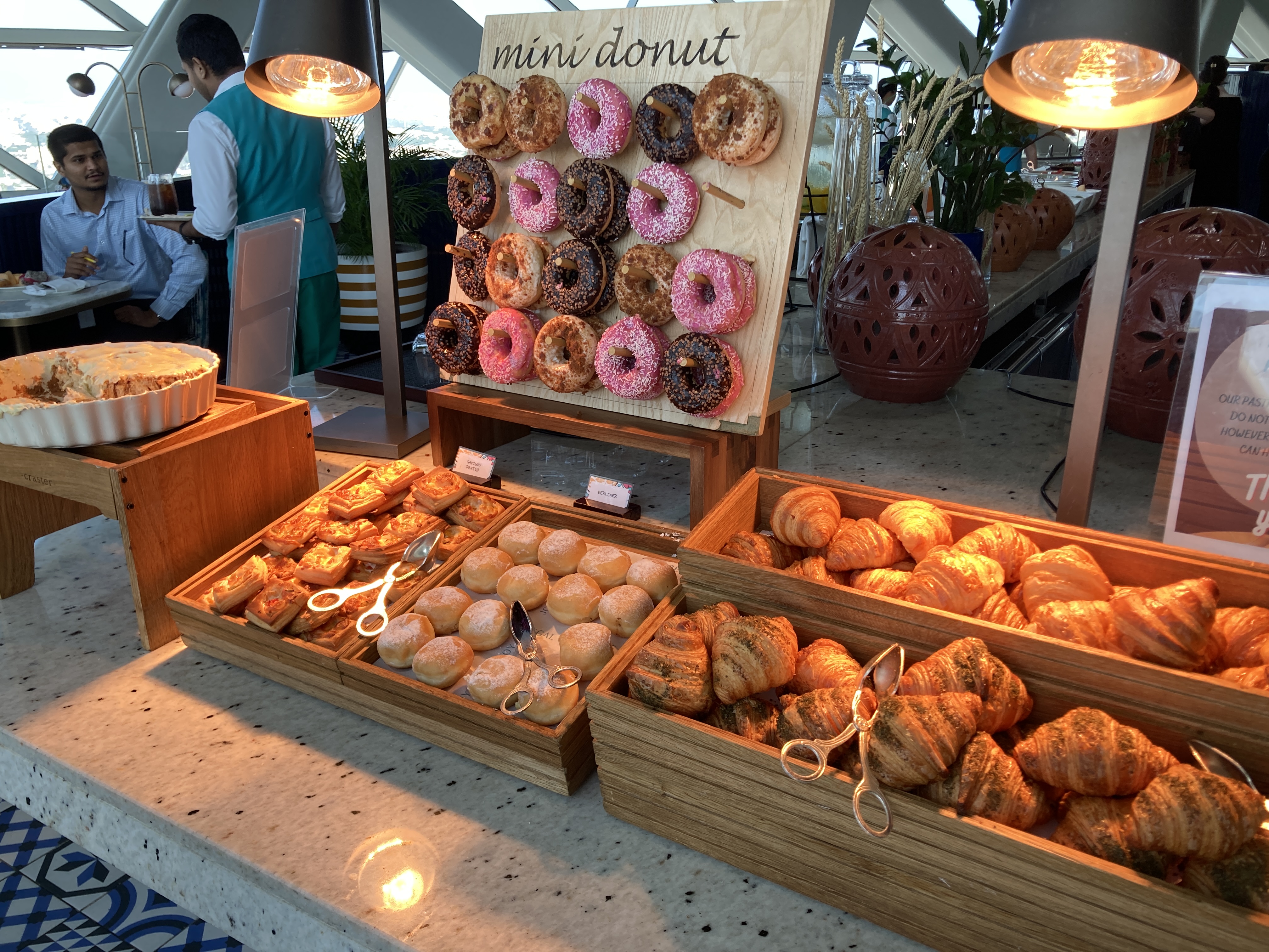 Andaz Capital Gate Abu Dhabi Cyan breakfast donut wall