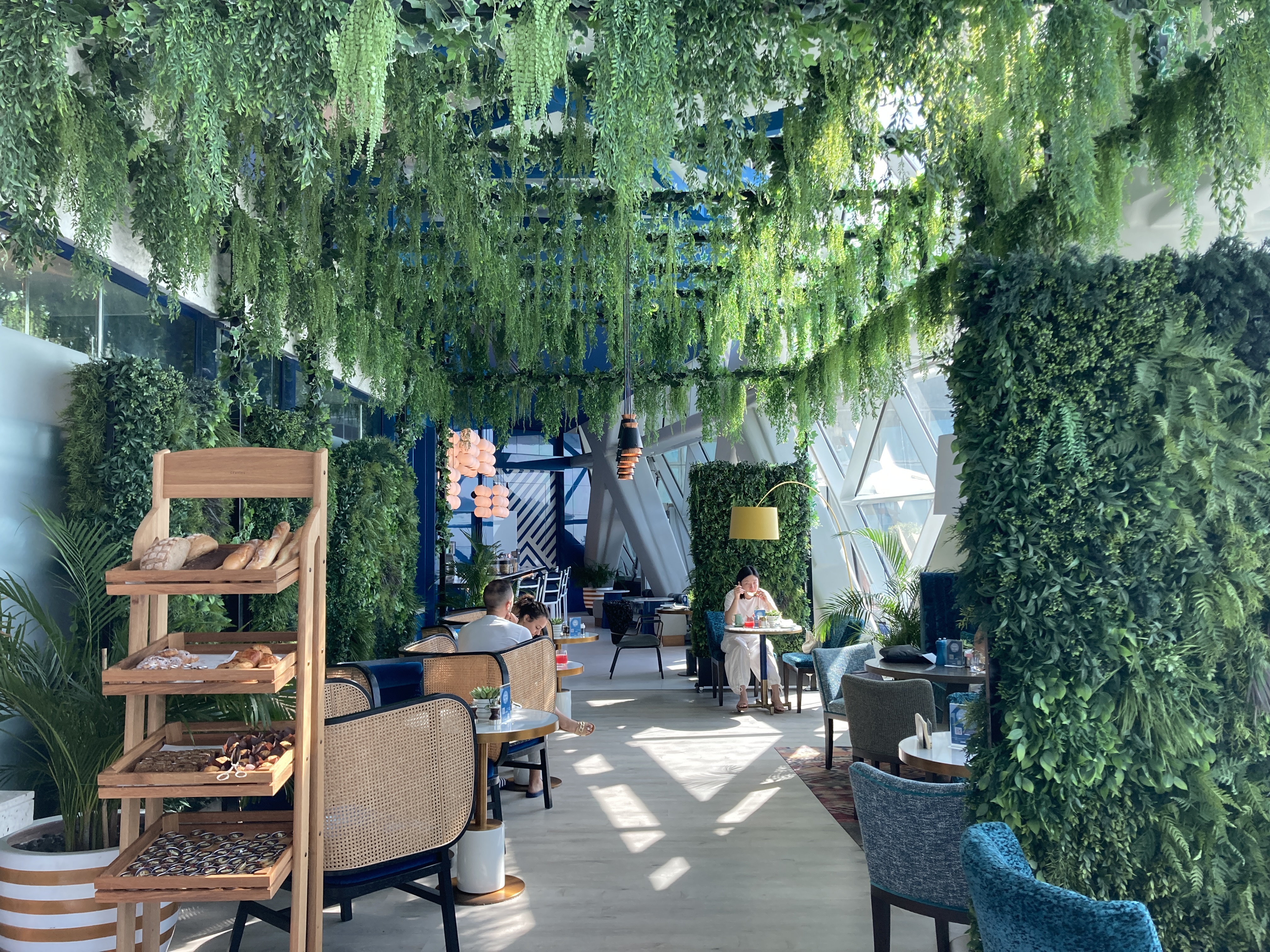 Andaz Capital Gate Abu Dhabi Cyan breakfast green dining area