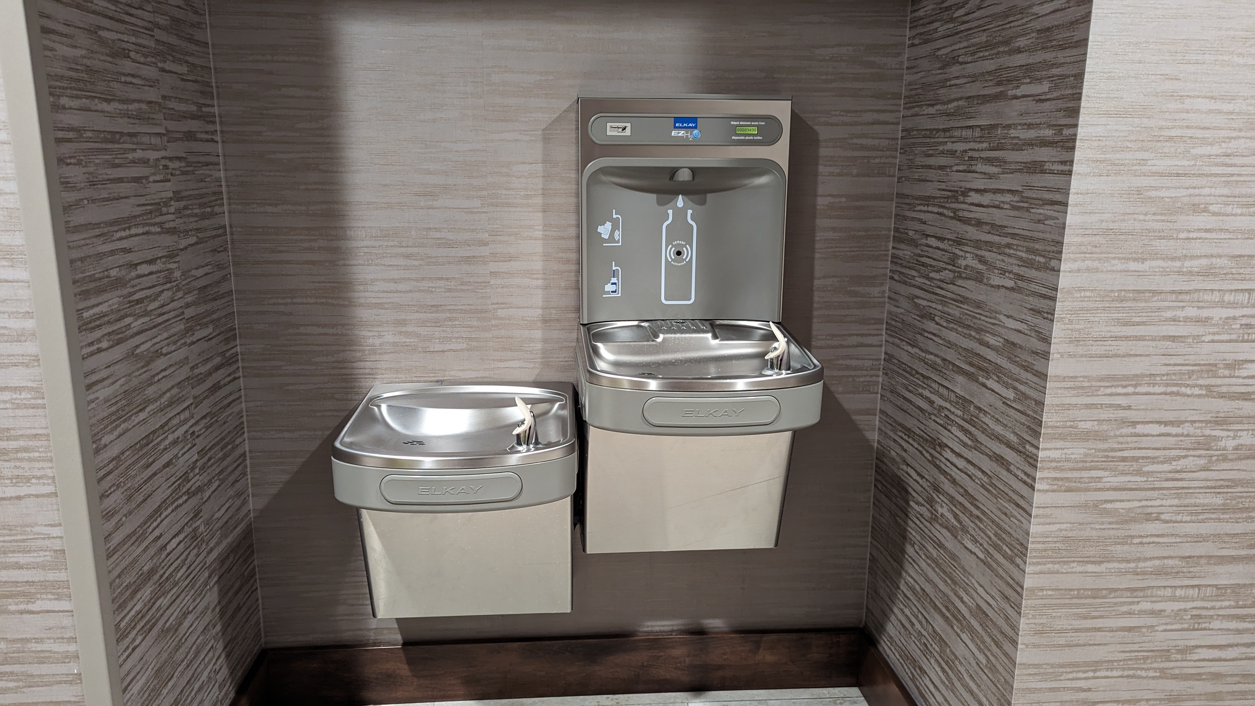 Hampton Inn and Suites Aurora South Denver amenities fitness center hallway water fountain