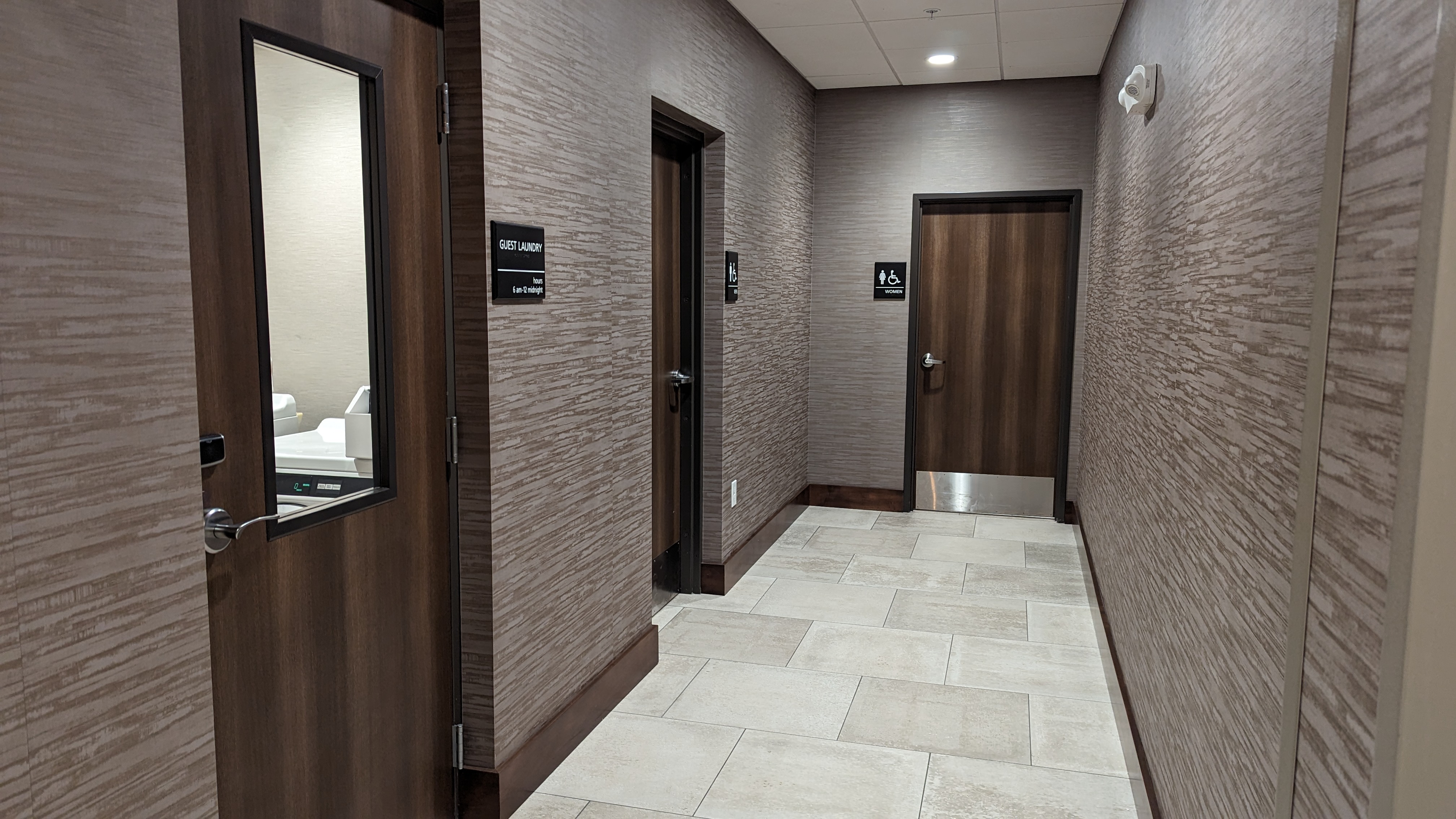 Hampton Inn and Suites Aurora South Denver amenities laundry room