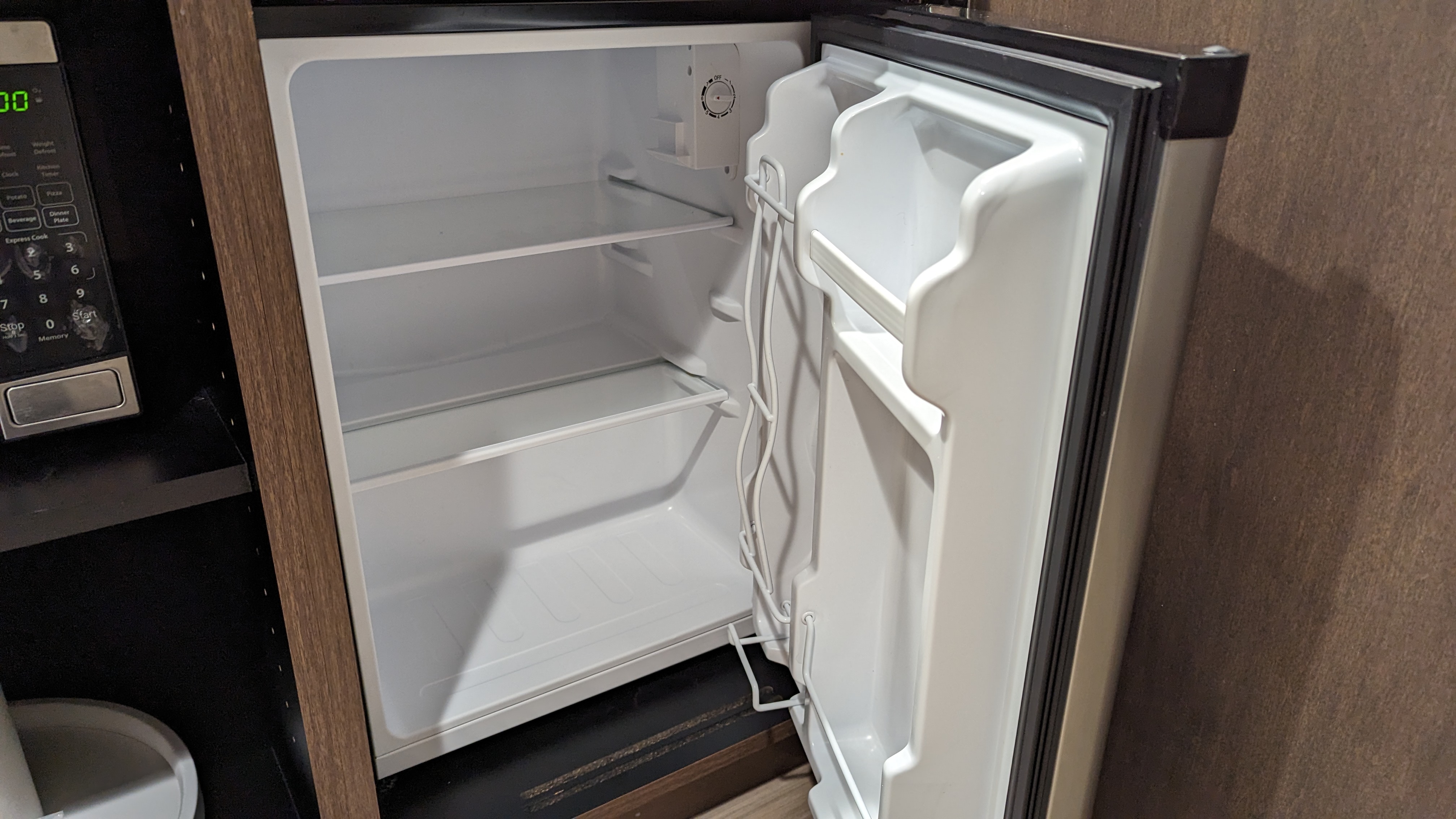 Hampton Inn and Suites Aurora South Denver room entrance mini kitchen mini fridge