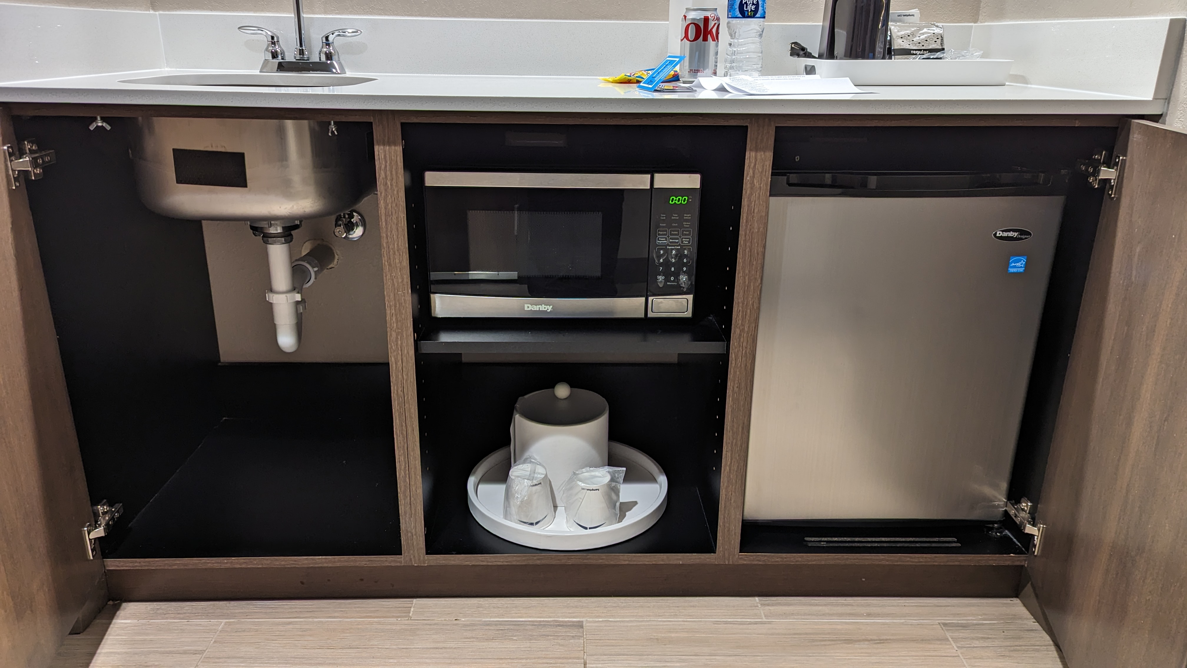 Hampton Inn and Suites Aurora South Denver room entrance mini kitchen with microwave and mini fridge