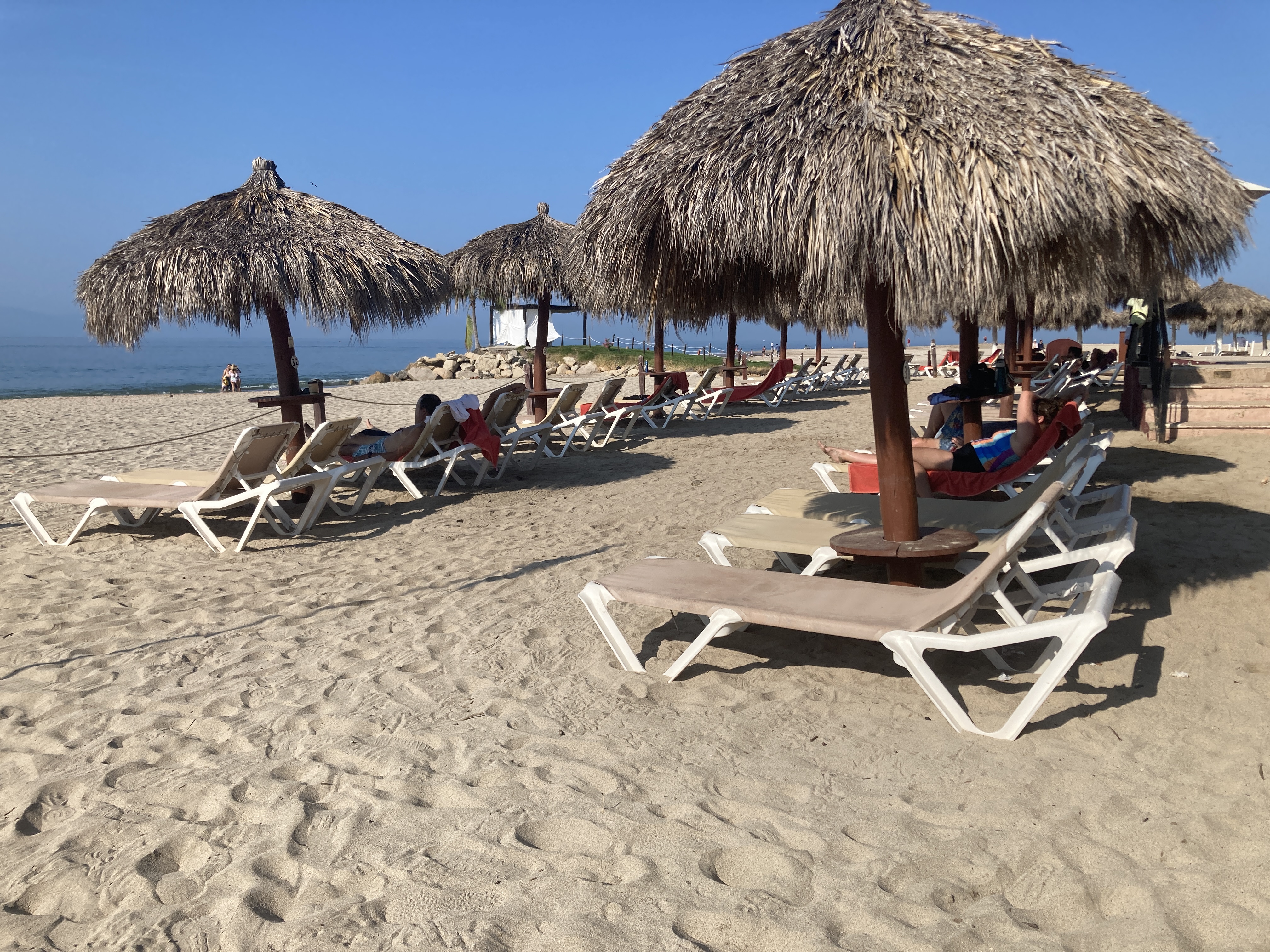 Sunscape Puerto Vallarta Resort Spa beach loungers with umbrellas Sunscape Puerto Vallarta Resort Spa beach loungers with umbrellas