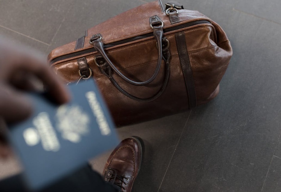 Traveler with passport and bag