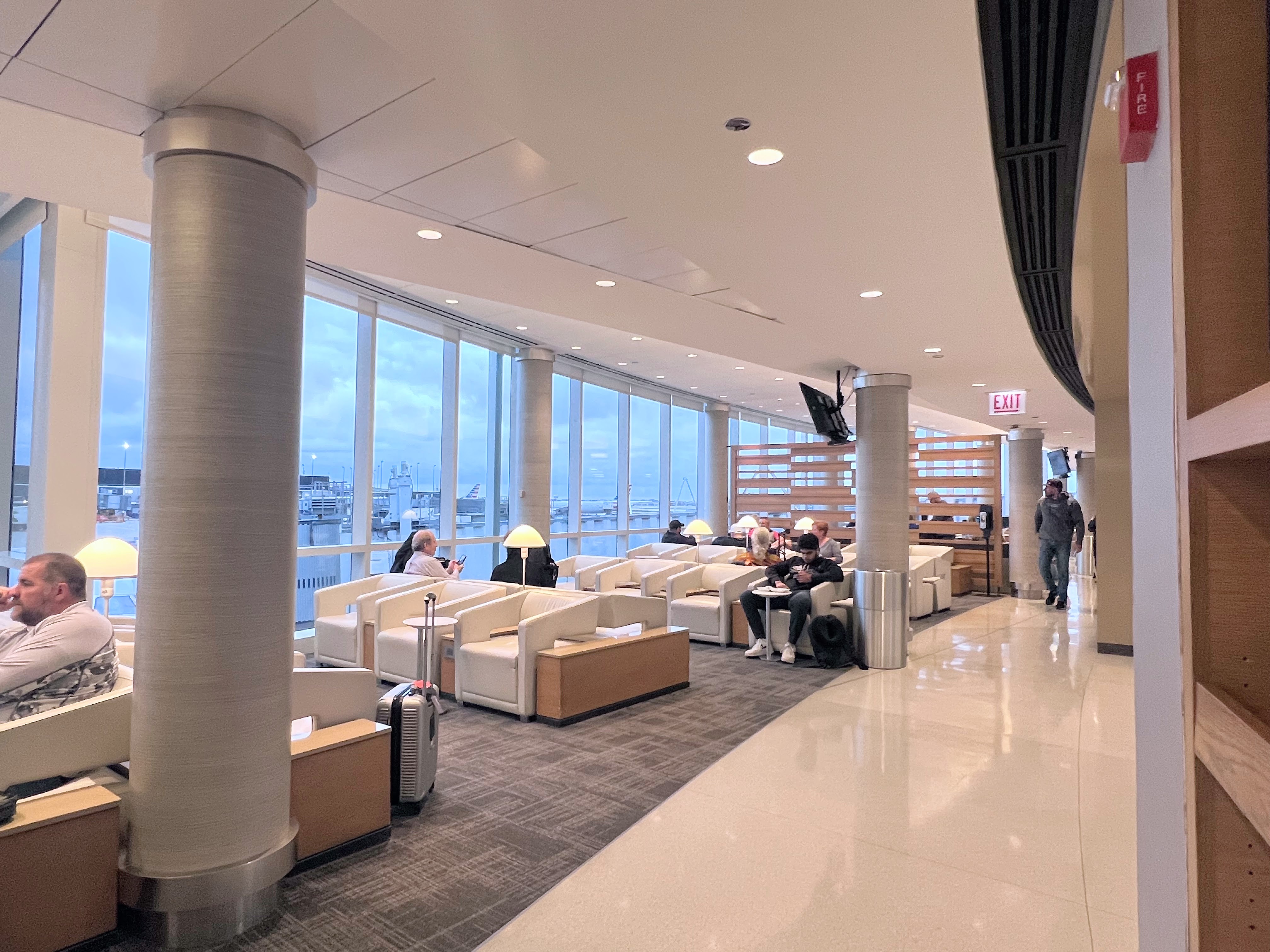 Admirals Club ORD Concourse HK bar and view of runway Windows at Admirals Club ORD Concourse G