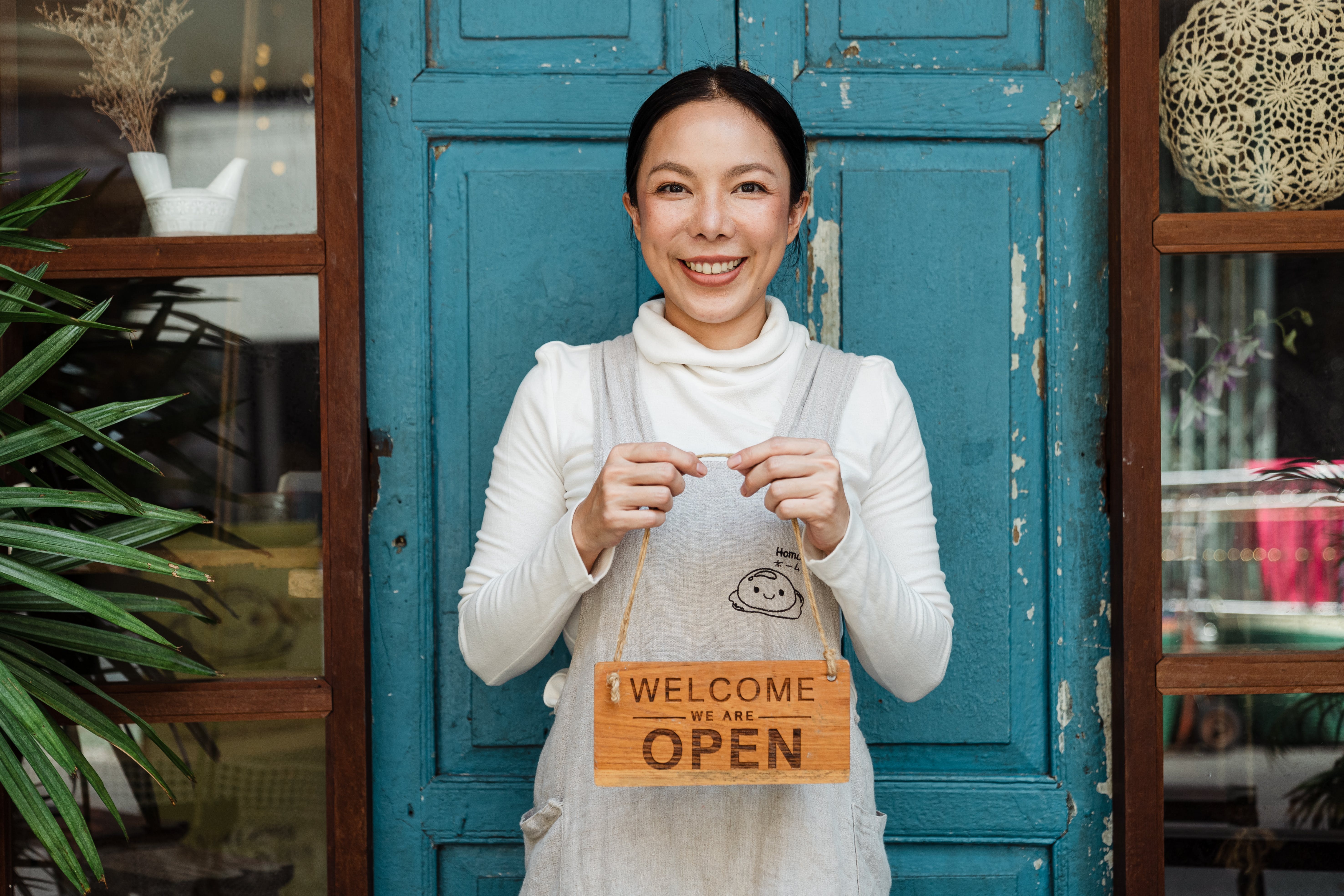 Business Owner Holding Sign