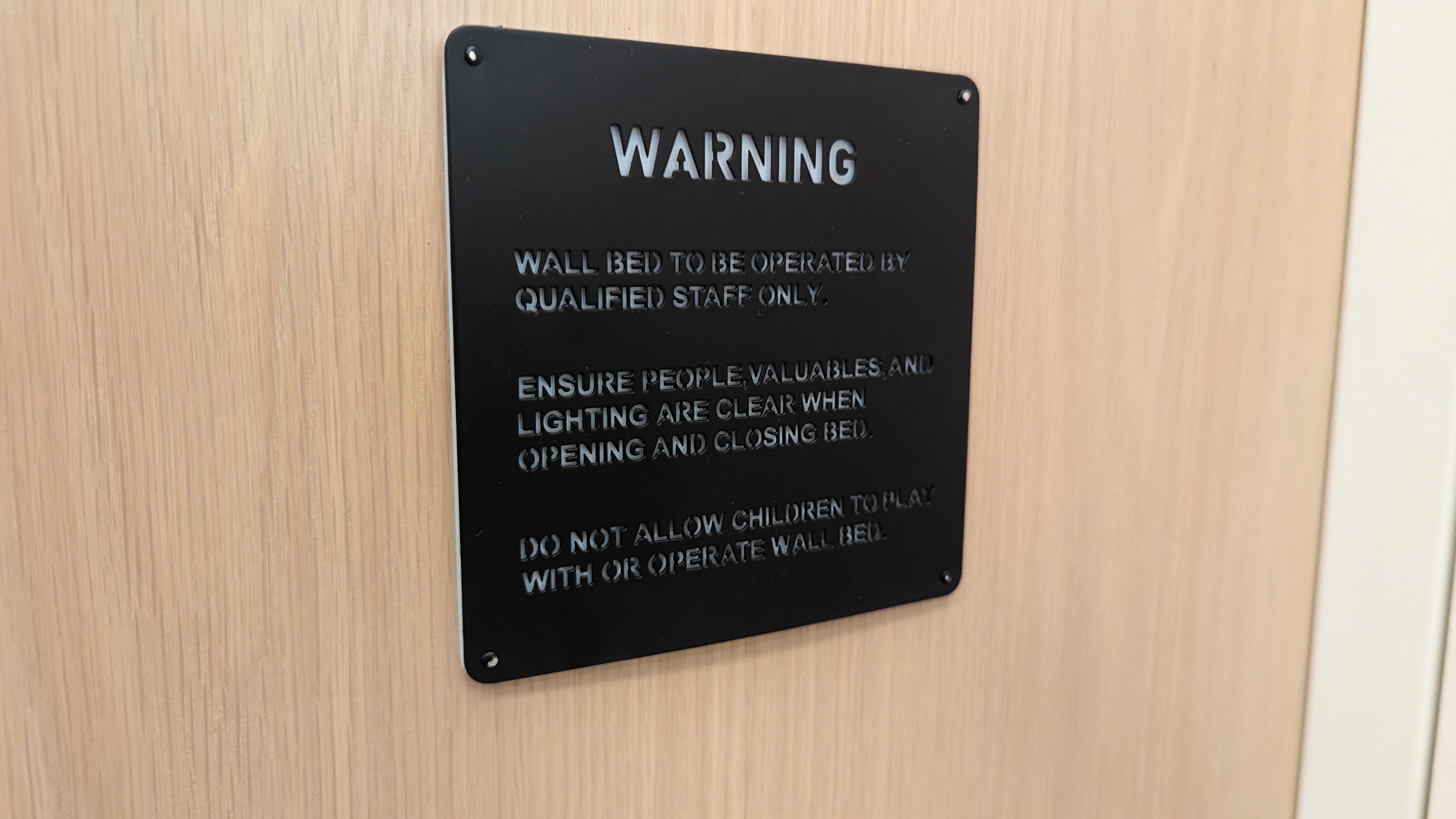 Motto by Hilton New York City Times Square guestroom bedroom murphy bed warning