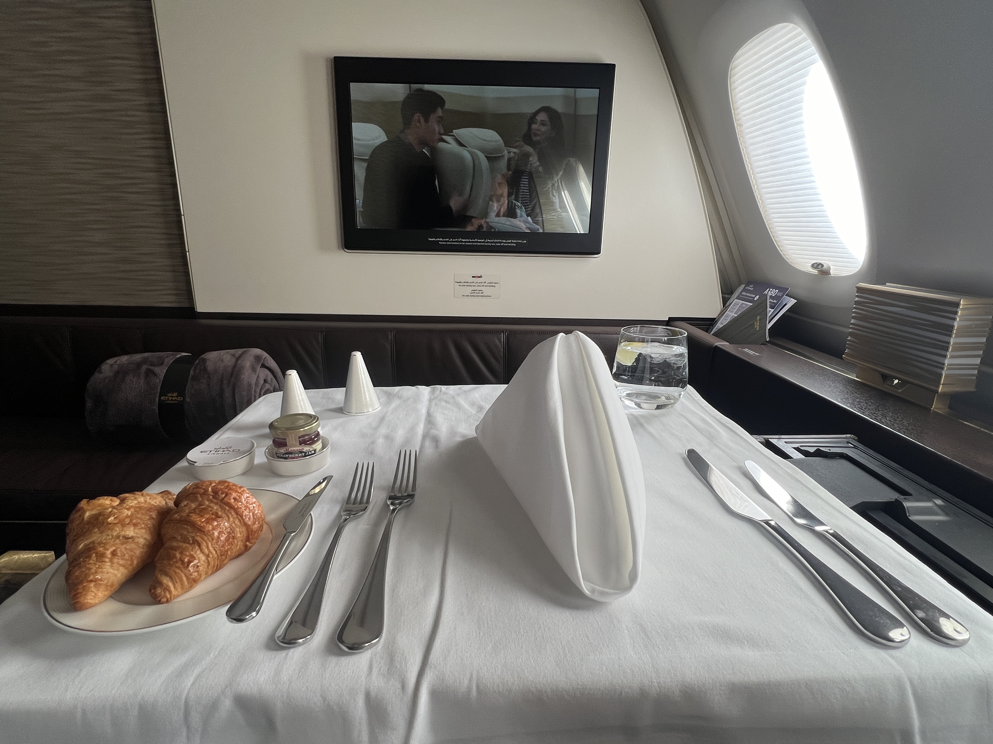 Etihad First Class Apartment Tray Table With White Tablecloth Etihad First Class Apartment Tray Table With White Tablecloth