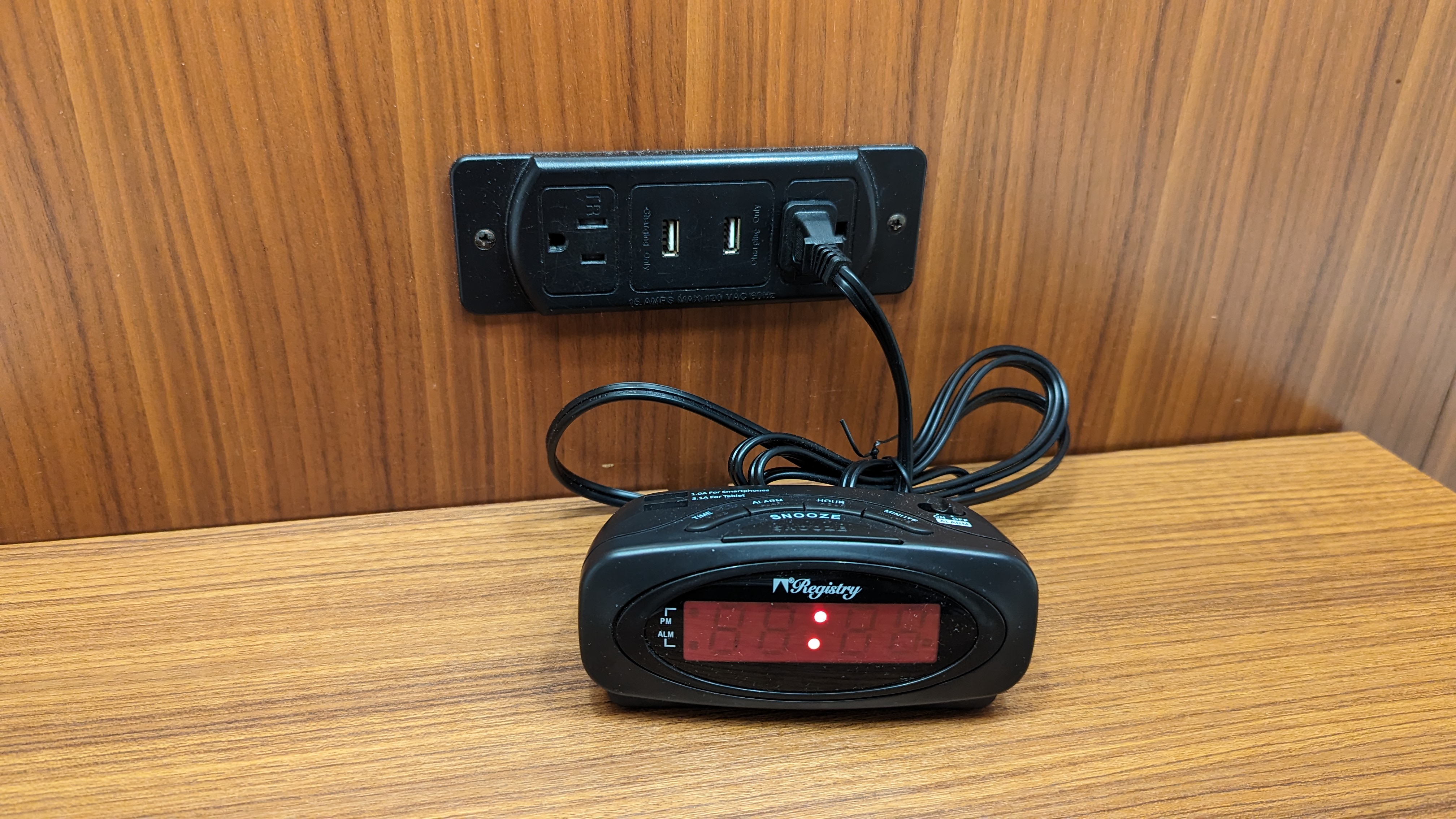 Hilton Pensacola Beach guestroom alarm clock and outlet