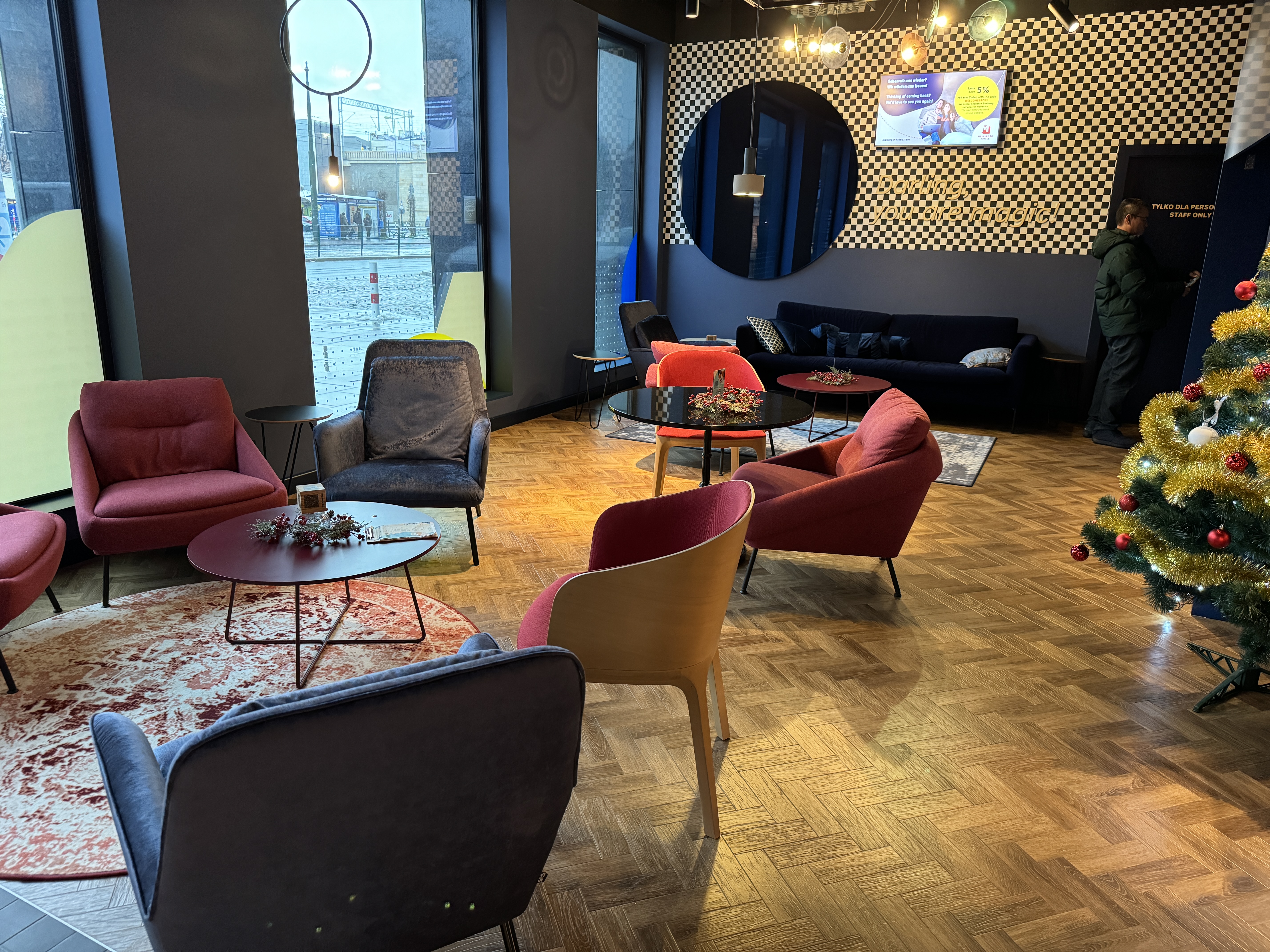 MEININGER Krakow Centrum lobby left seating MEININGER Krakow Centrum lobby left seating