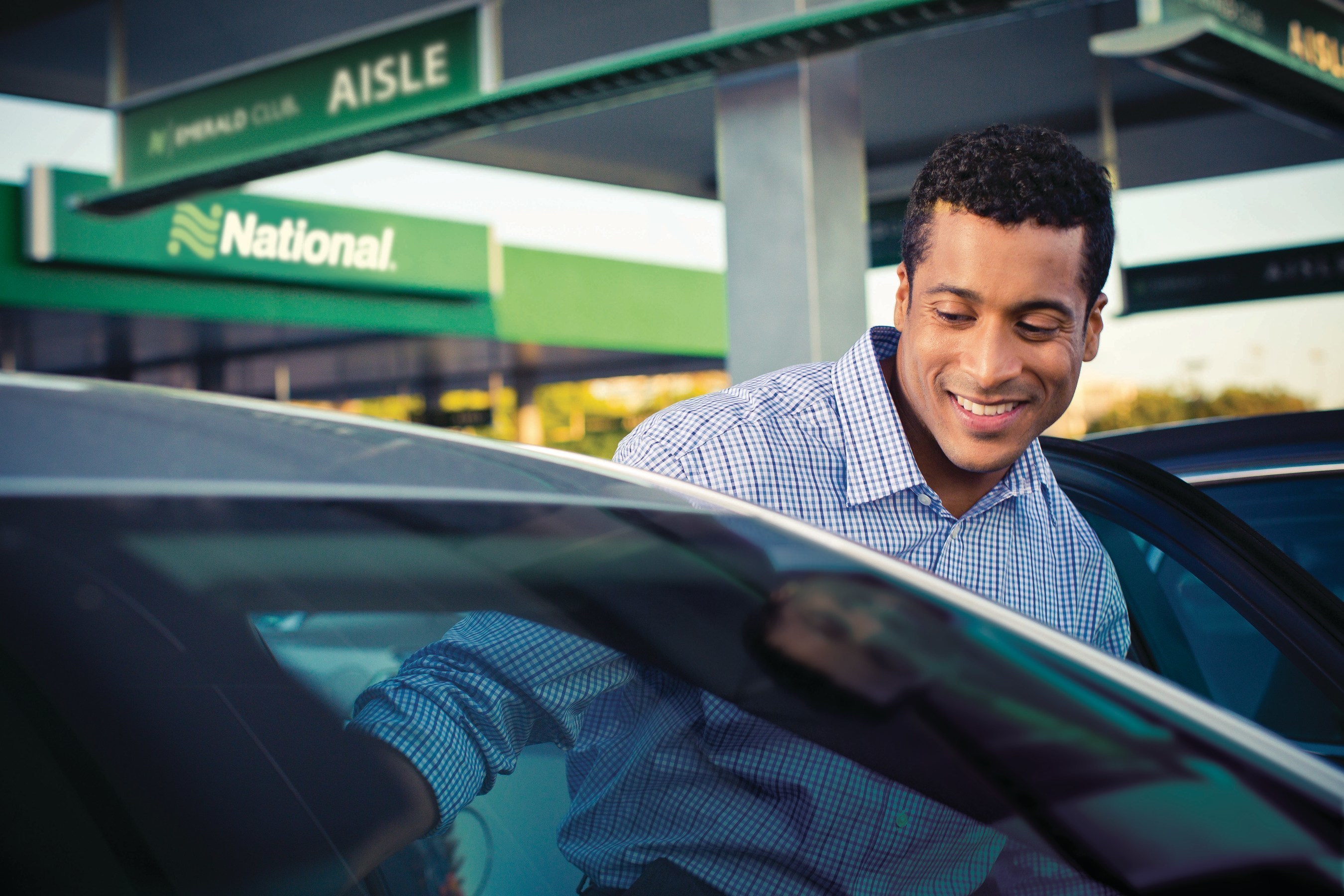 Passenger getting into a National Car Rental vehicle Passenger getting into a National Car Rental vehicle