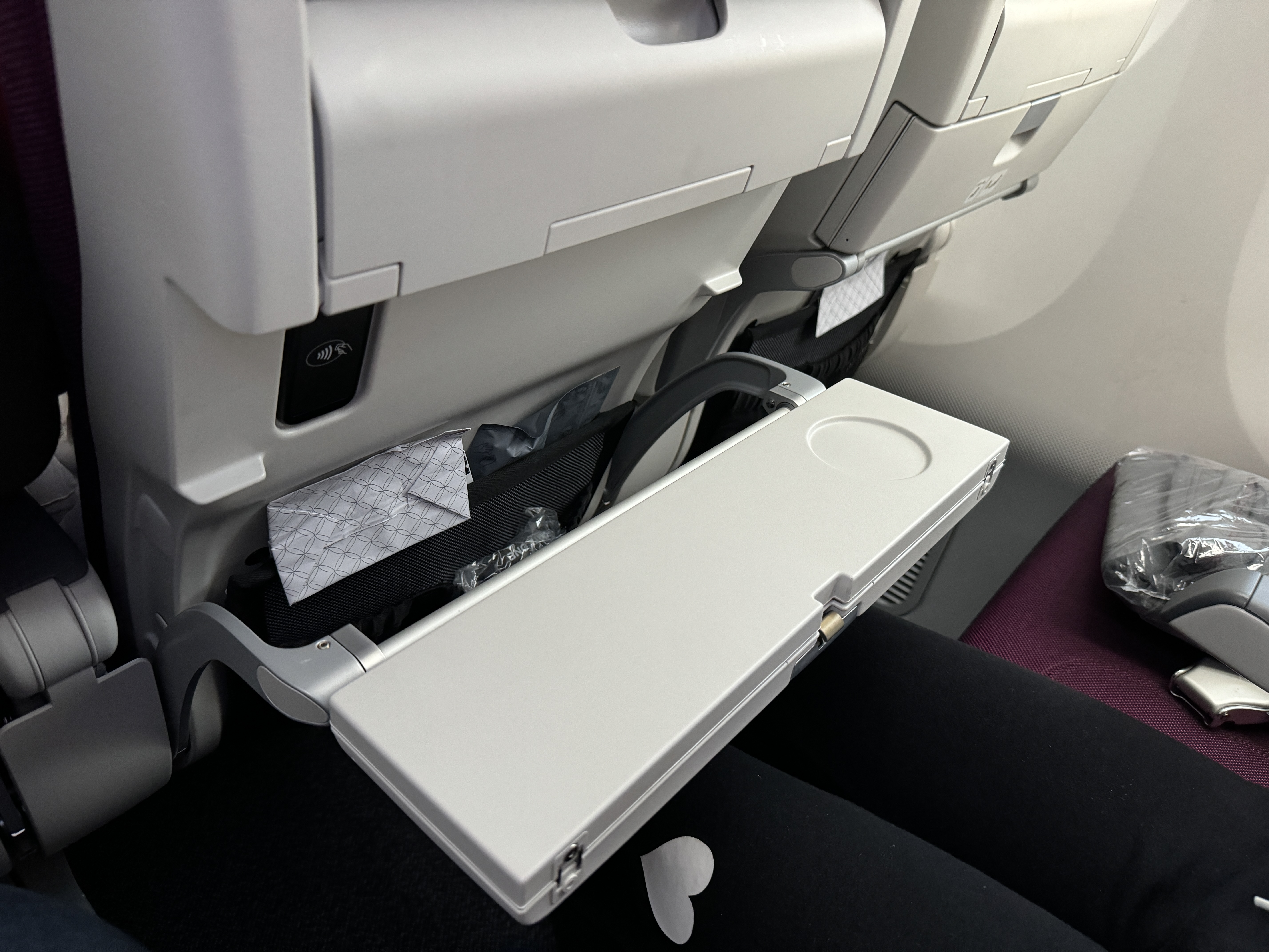 Qatar Airways economy WAW DOH 787 tray table folded Qatar Airways economy WAW DOH 787 tray table folded