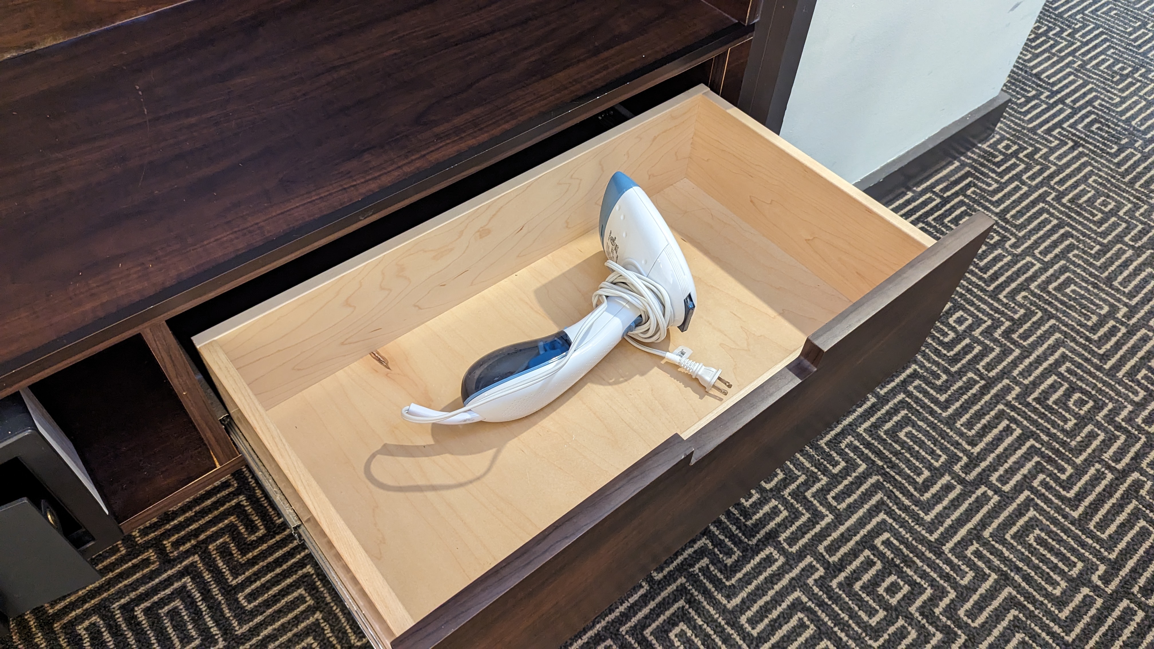 The Troubadour Hotel New Orleans guestroom closet drawer and steamer