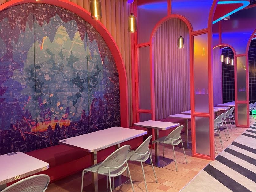 Cafe seating at Meow Wolf Grapevine The Real Unreal