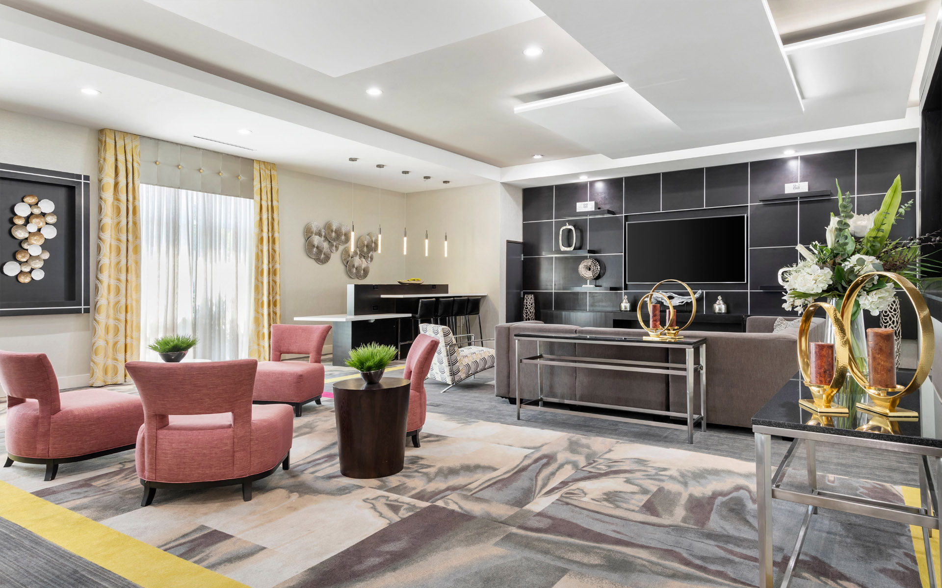 Holiday Inn Express Suites Anaheim lobby A photo of the lobby at Holiday Inn Express Suites Anaheim Resorts Area shows a seating area that includes a couch, 4 chairs, and a bar top area for dining.