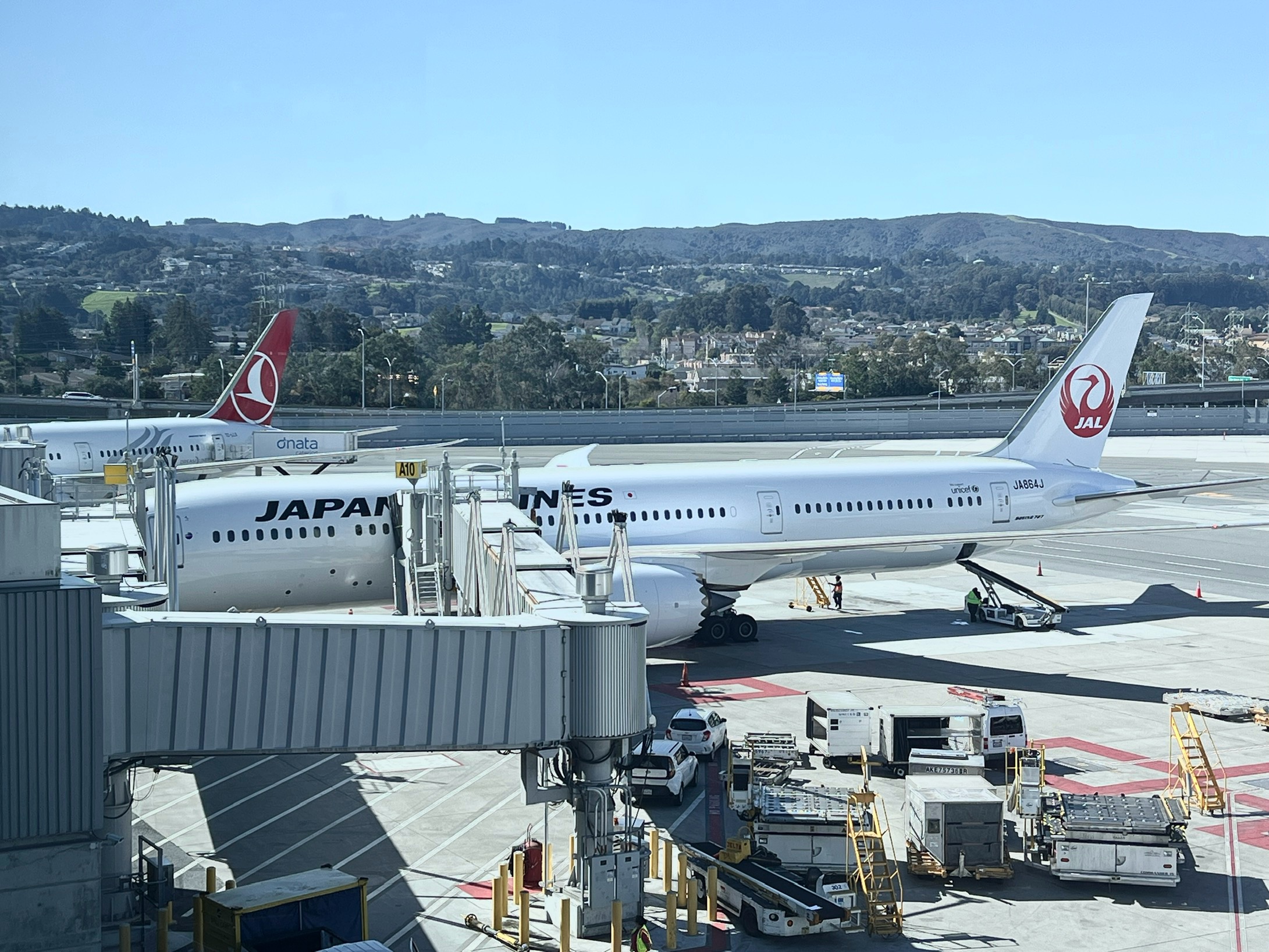 Japan Airlines JAL Boeing 787 Dreamliner at Tokyo NRT JAL 777 300ER parked at gate at San Francisco Airport