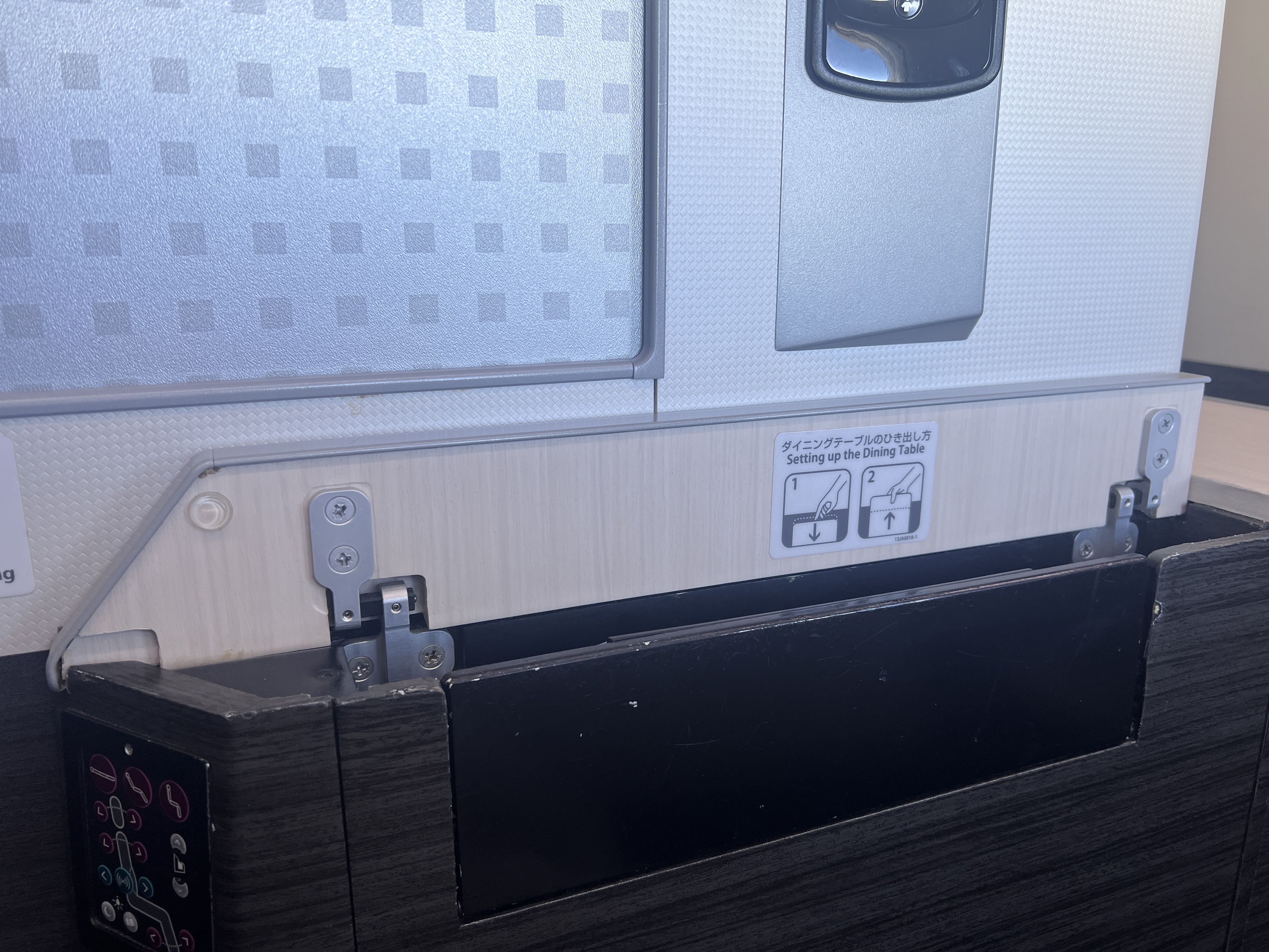 Japan Airlines business class tray table storage Japan Airlines business class tray table storage