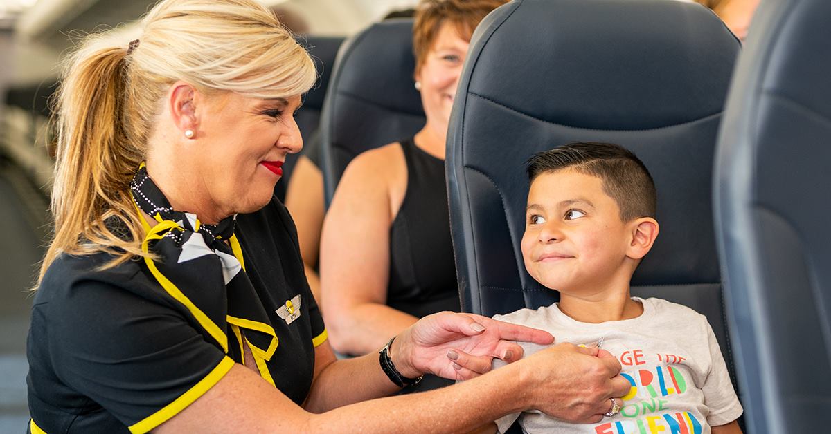 Spirit flight attendant with boy Spirit flight attendant with boy