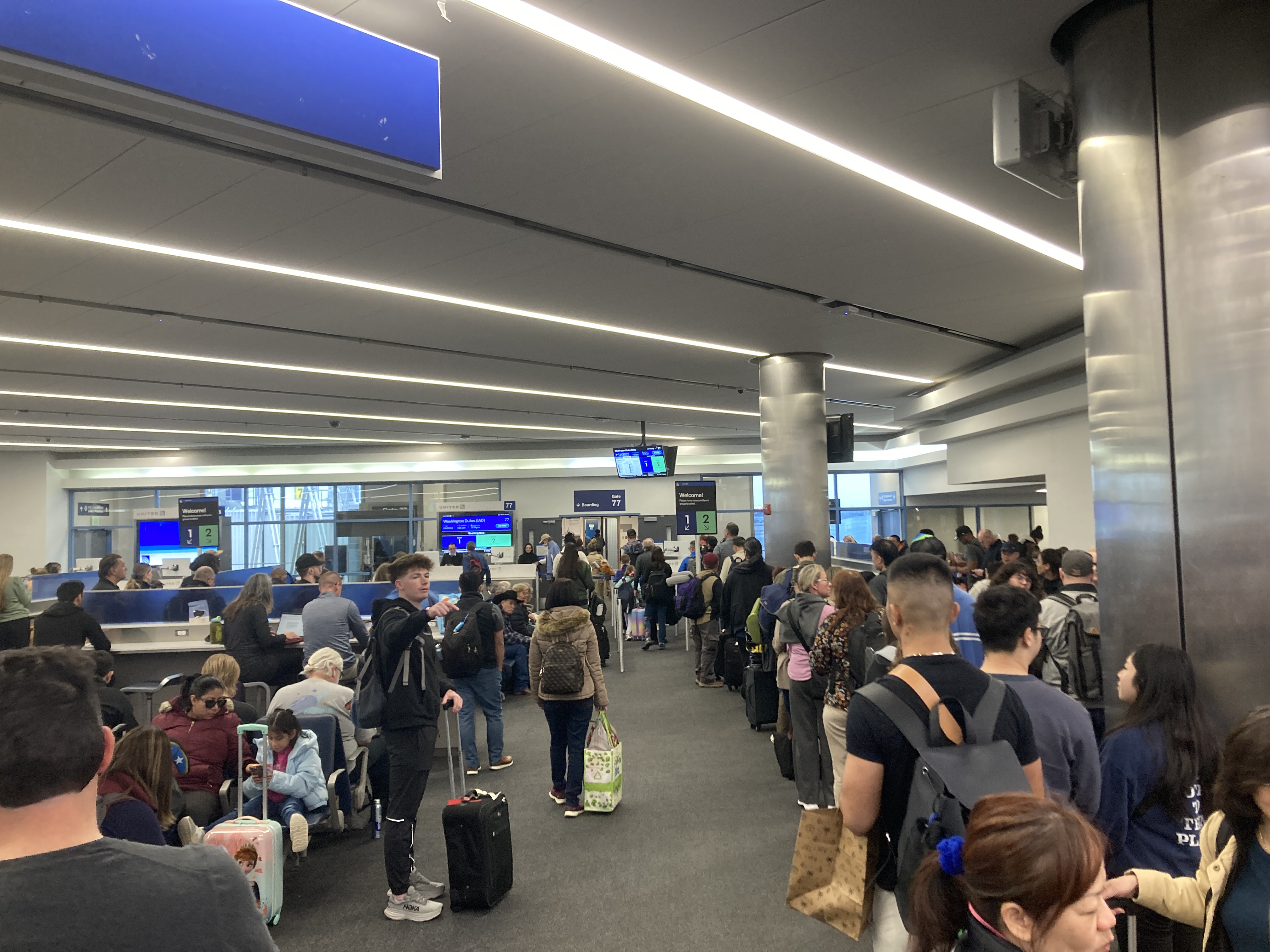 United boarding line at gate 77 for LAX IAD flight United boarding line at gate 77 for LAX IAD flight