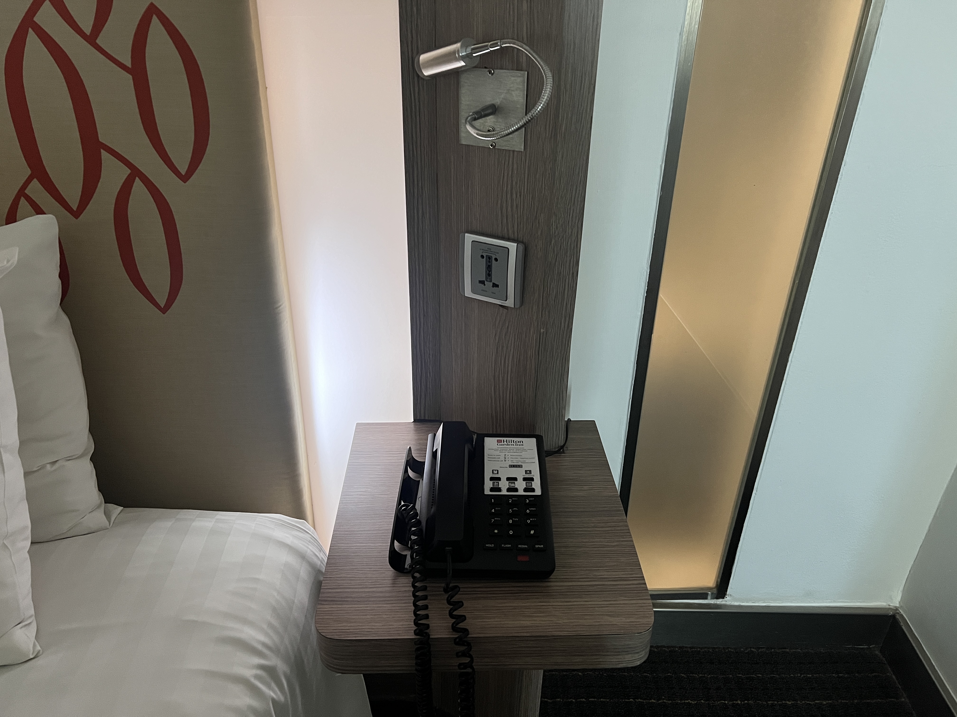Hilton Garden Inn Bangkok Silom room nightstand and phone