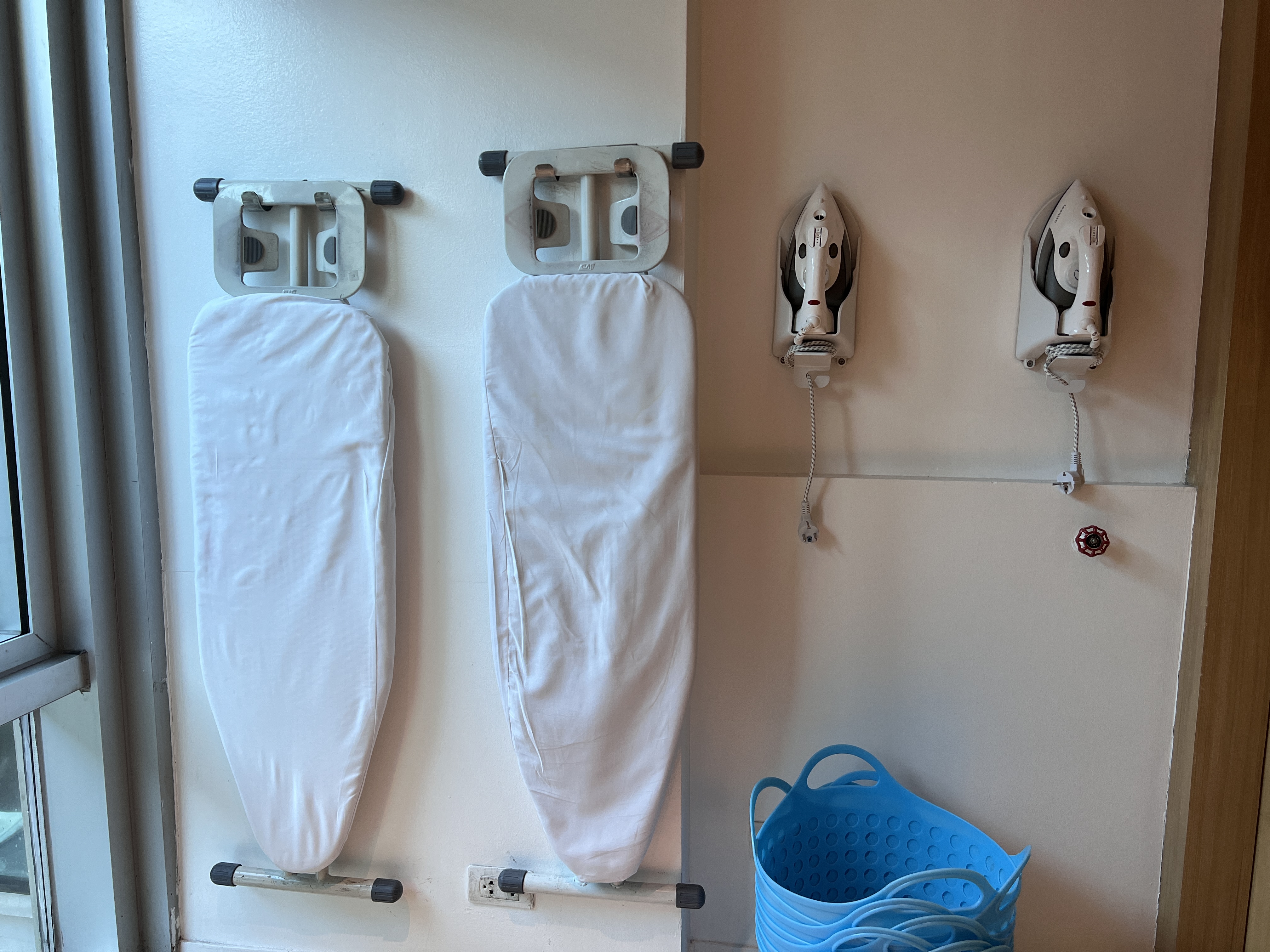 Holiday Inn Express Manila Newport City guest laundry room irons and board