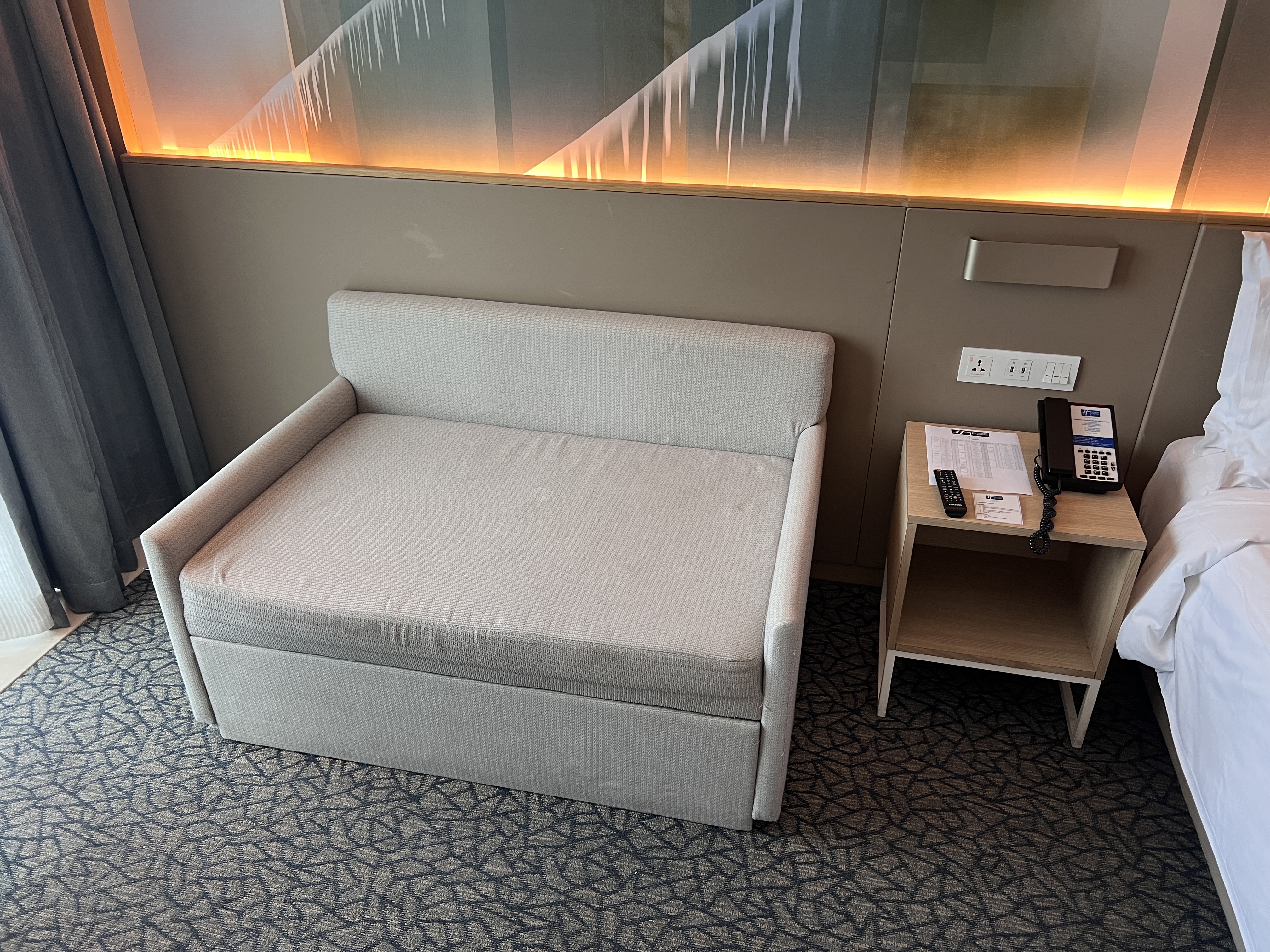 Holiday Inn Express Manila Newport City room couch sofa